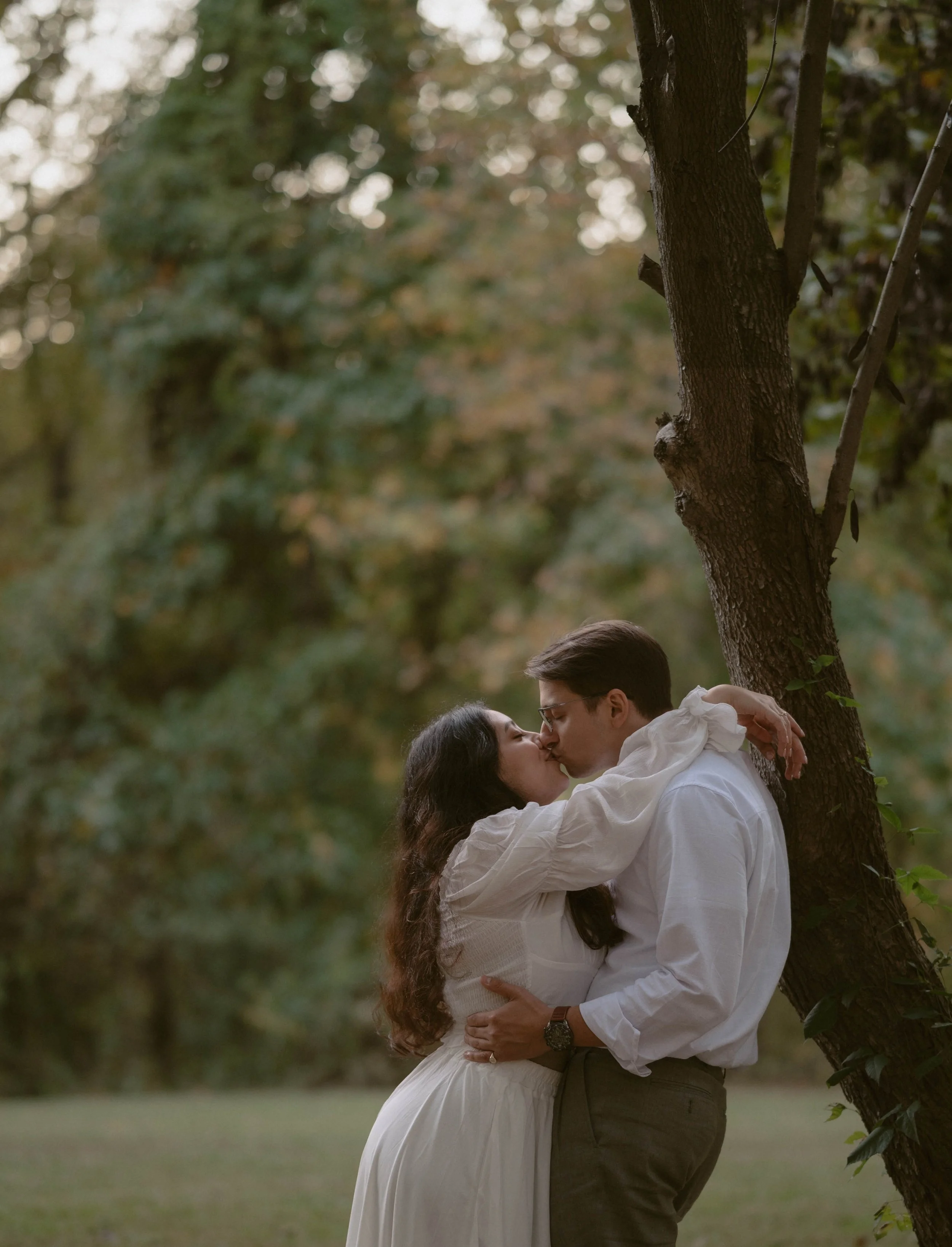 Couple kiss during a Jane Austen film-inspired engagement session  in Southern Maryland.
