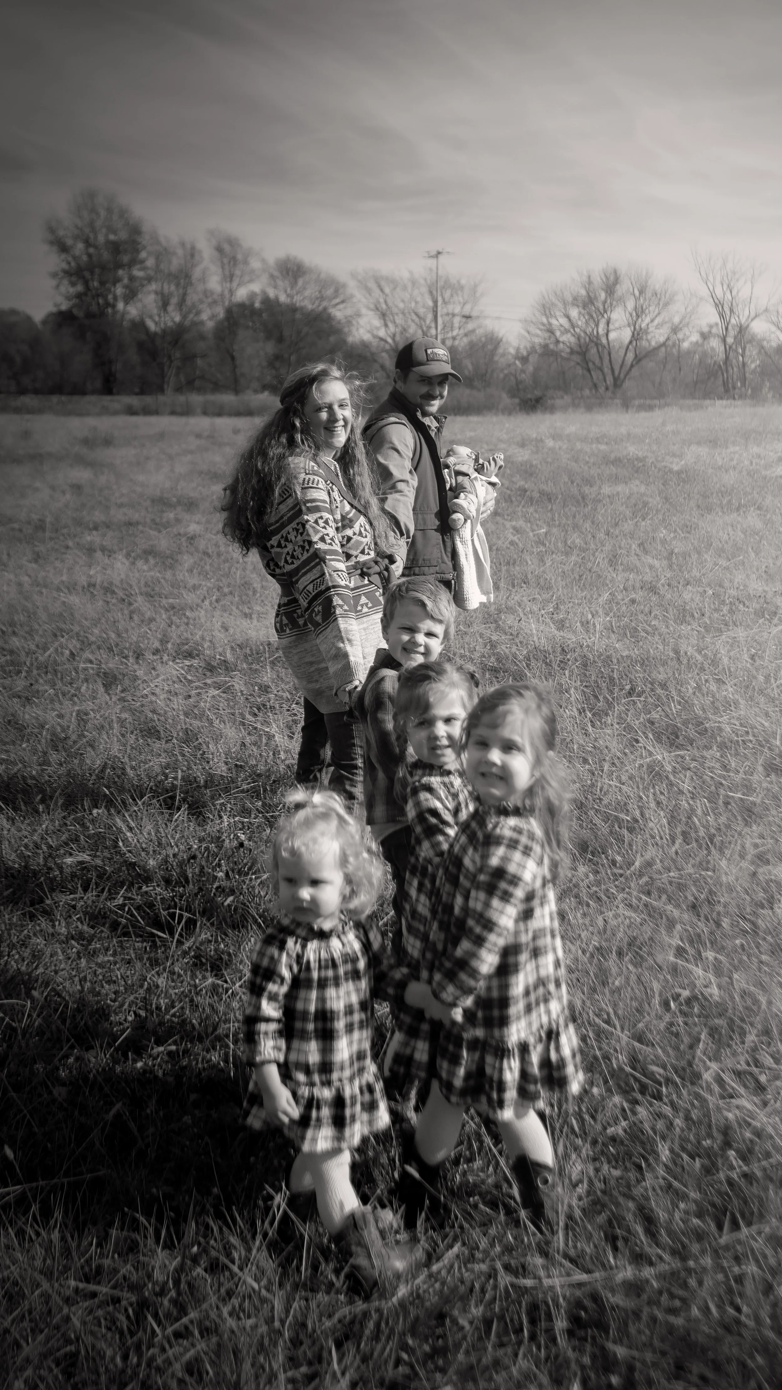 Catagnani-family-in-pasture-in-a-row-B&W.jpg
