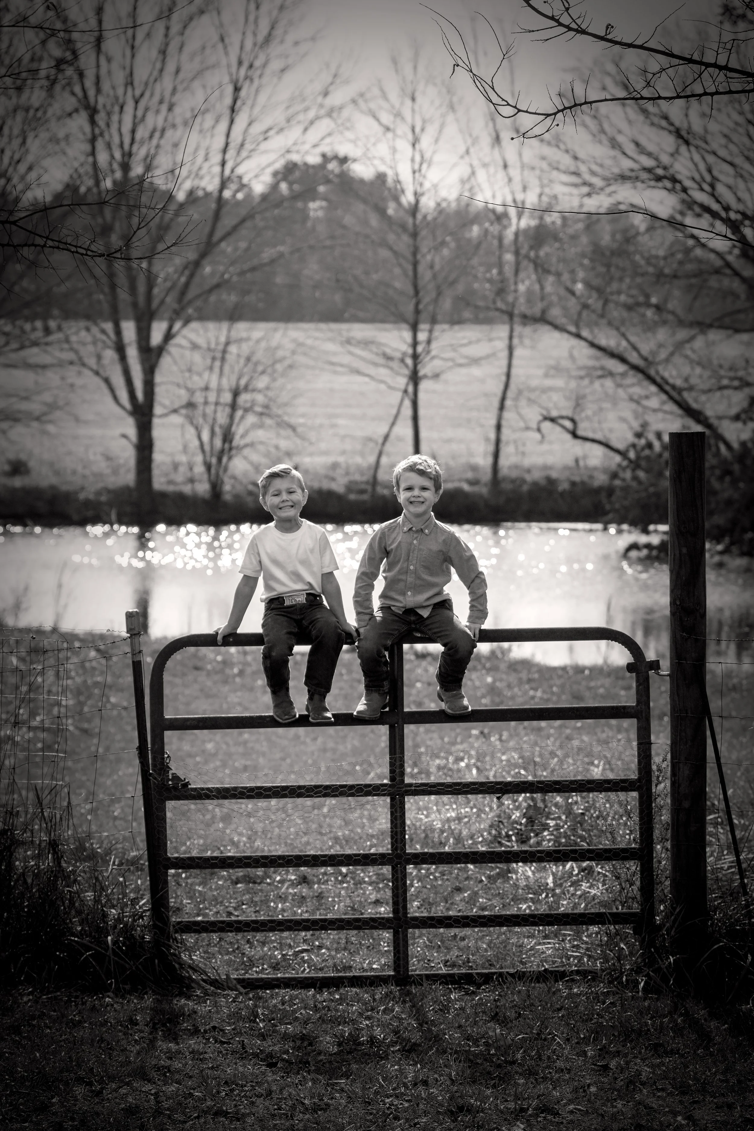 catagnani-family-derek-and-wyatt-on-fence.B&Wjpg.jpg