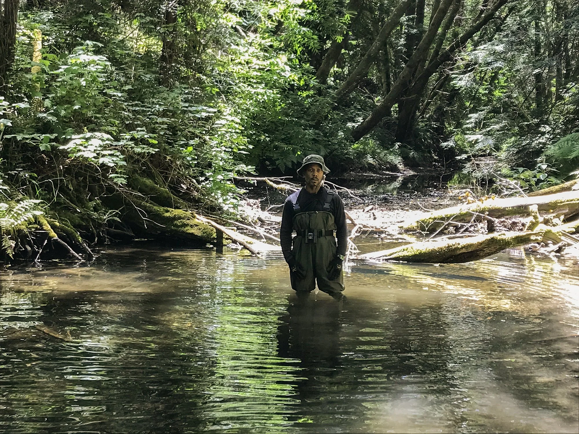 Lenard Smith standing in creek