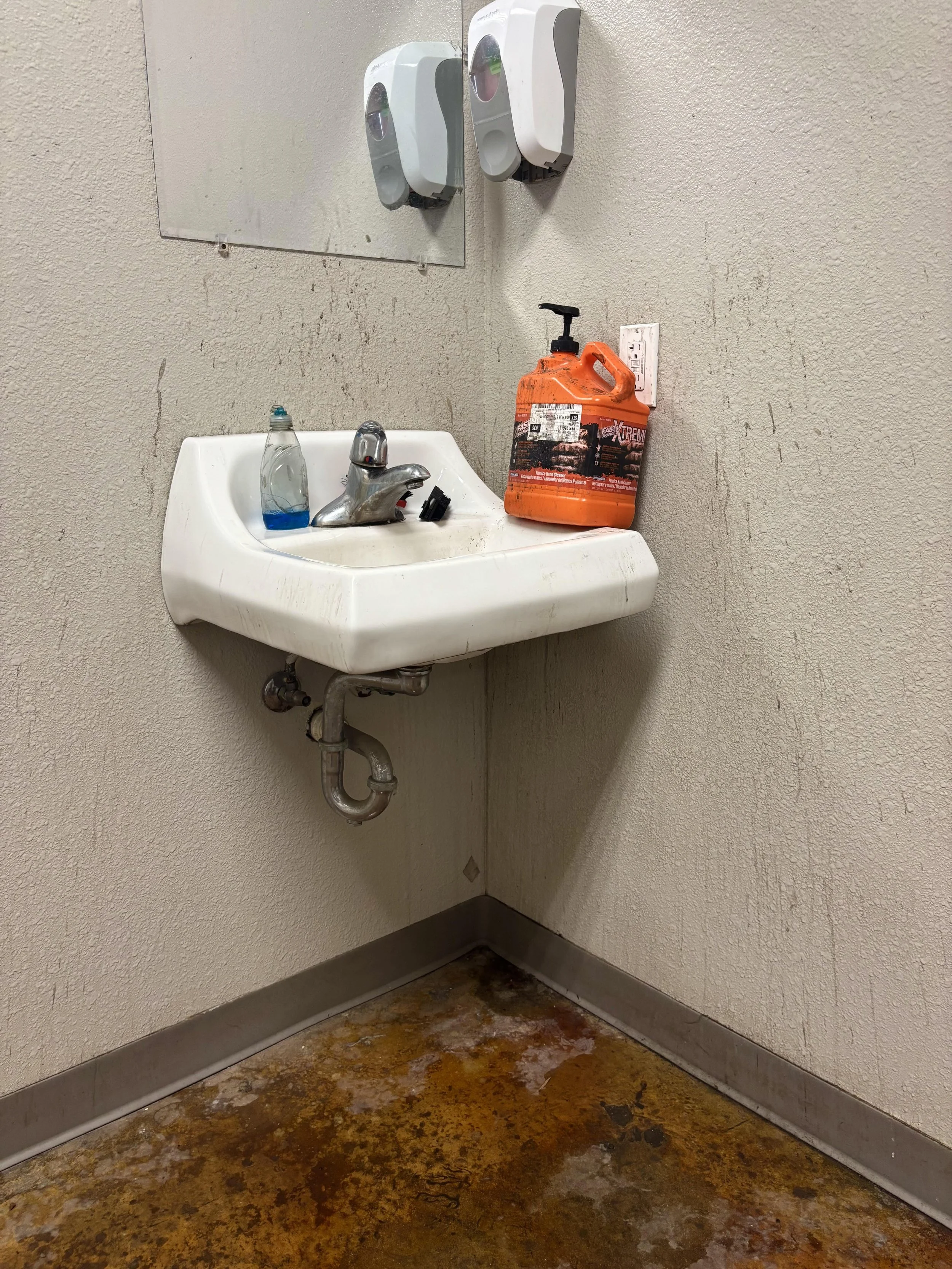Dirty Shop Restroom Sink & Wall