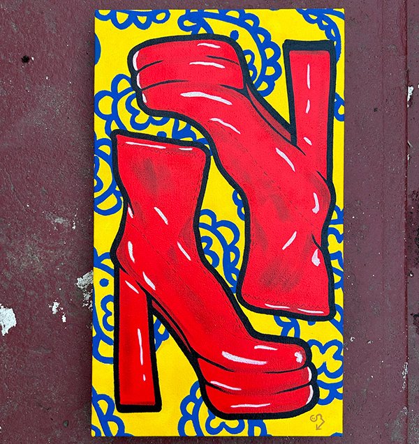 Pop art painting of red boots on a yellow background with blue decorative elements.