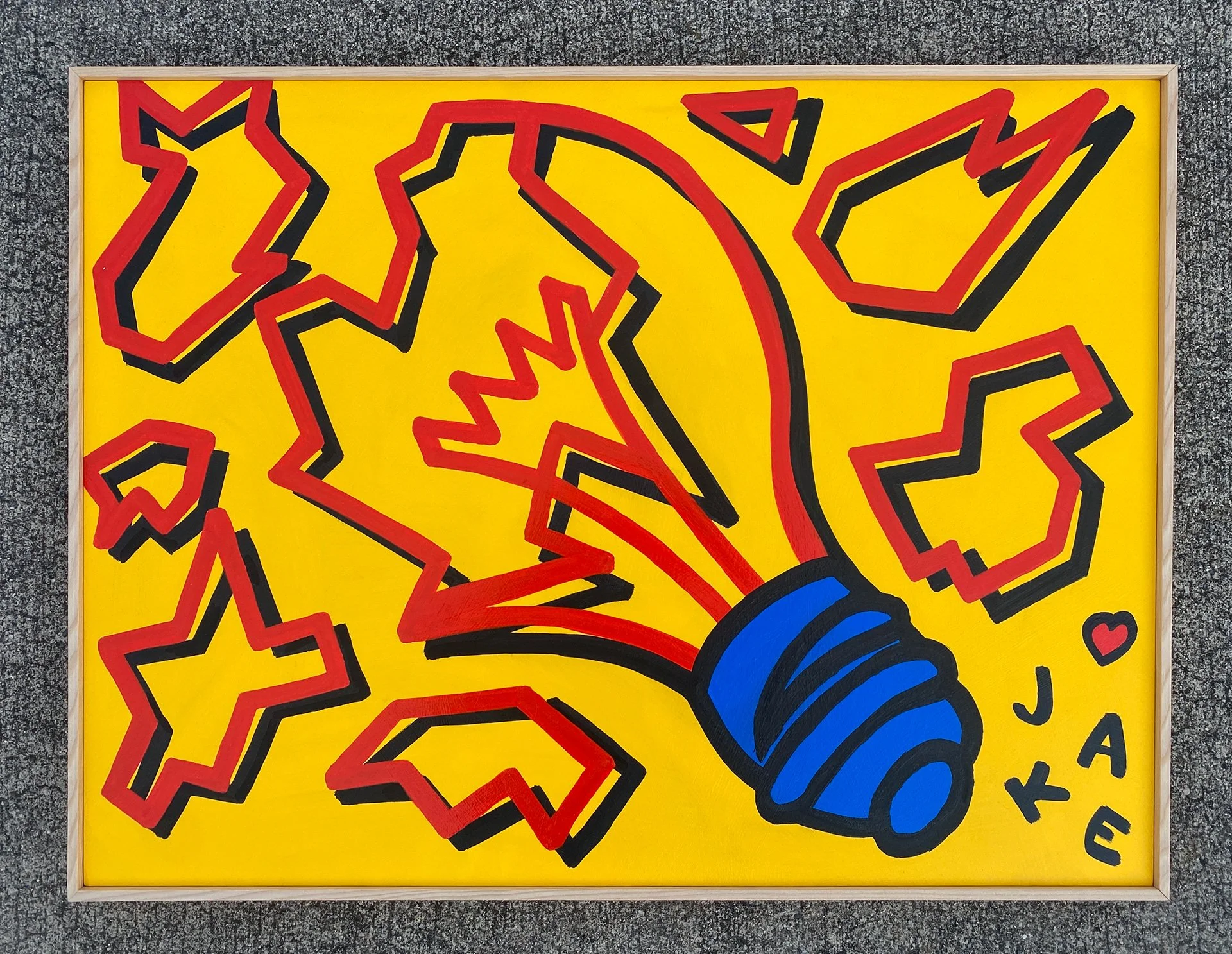 Pop art style painting of a light bulb with red lightning bolt lines and yellow background, surrounded by red and black outlined stars, with the words 'JAK' and a small red heart.
