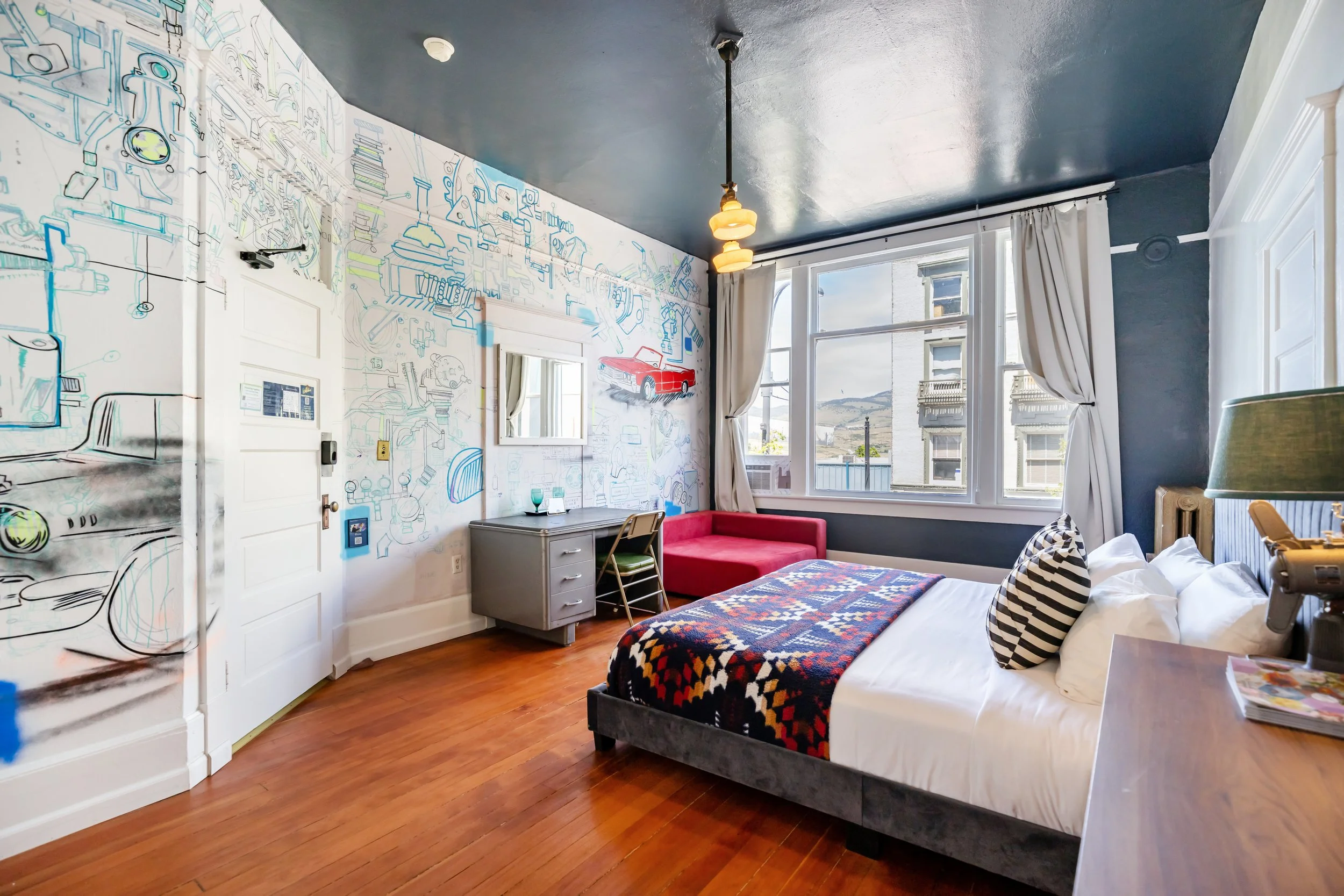 The Workshop Room of The Columbia Hotel. A Premium King with Common Bath down the Hall facing Main Street.