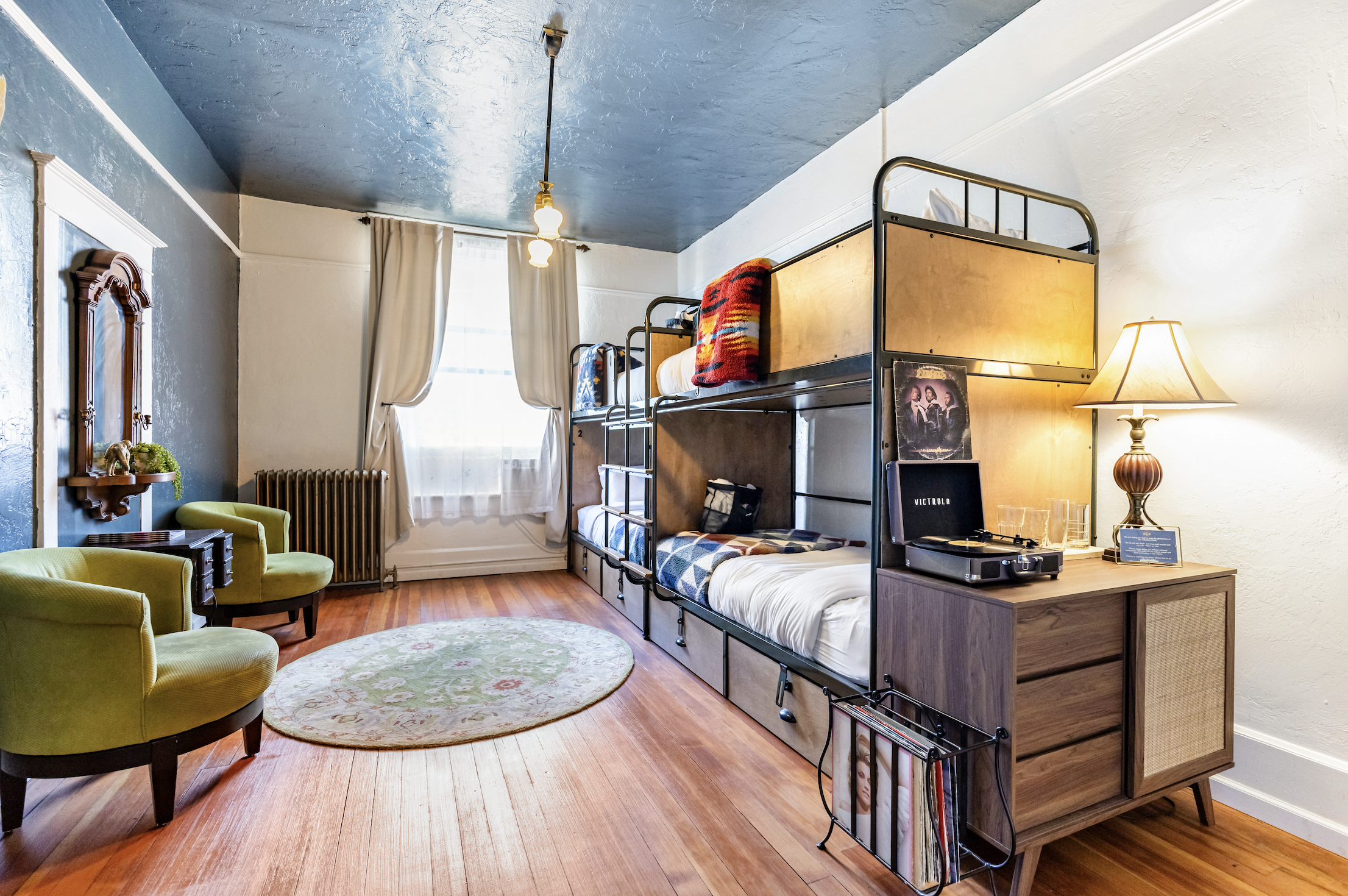 The Leanán Sídhe Room, a Premium Bunk Room with Common Bath down the Hall. Large space with sink in room and facing Main Street in downtown Ashland.

