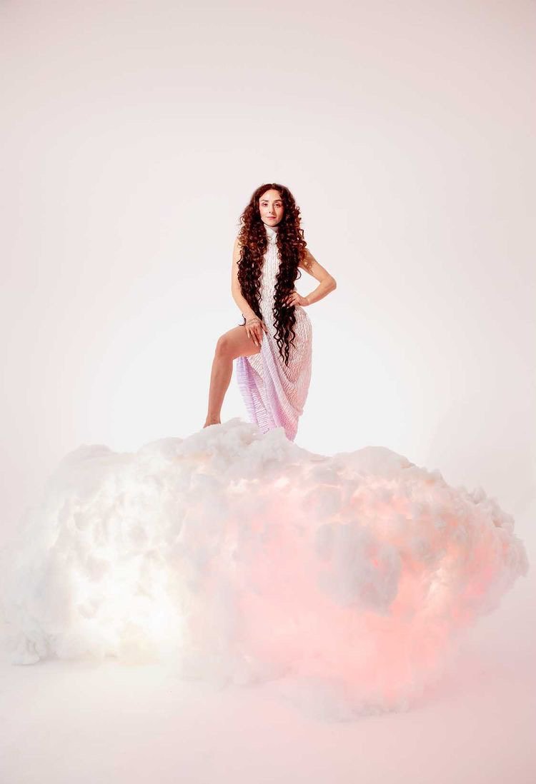 Sophia Batovrina in the full knitted wrap dress for her music video 'Padushki'