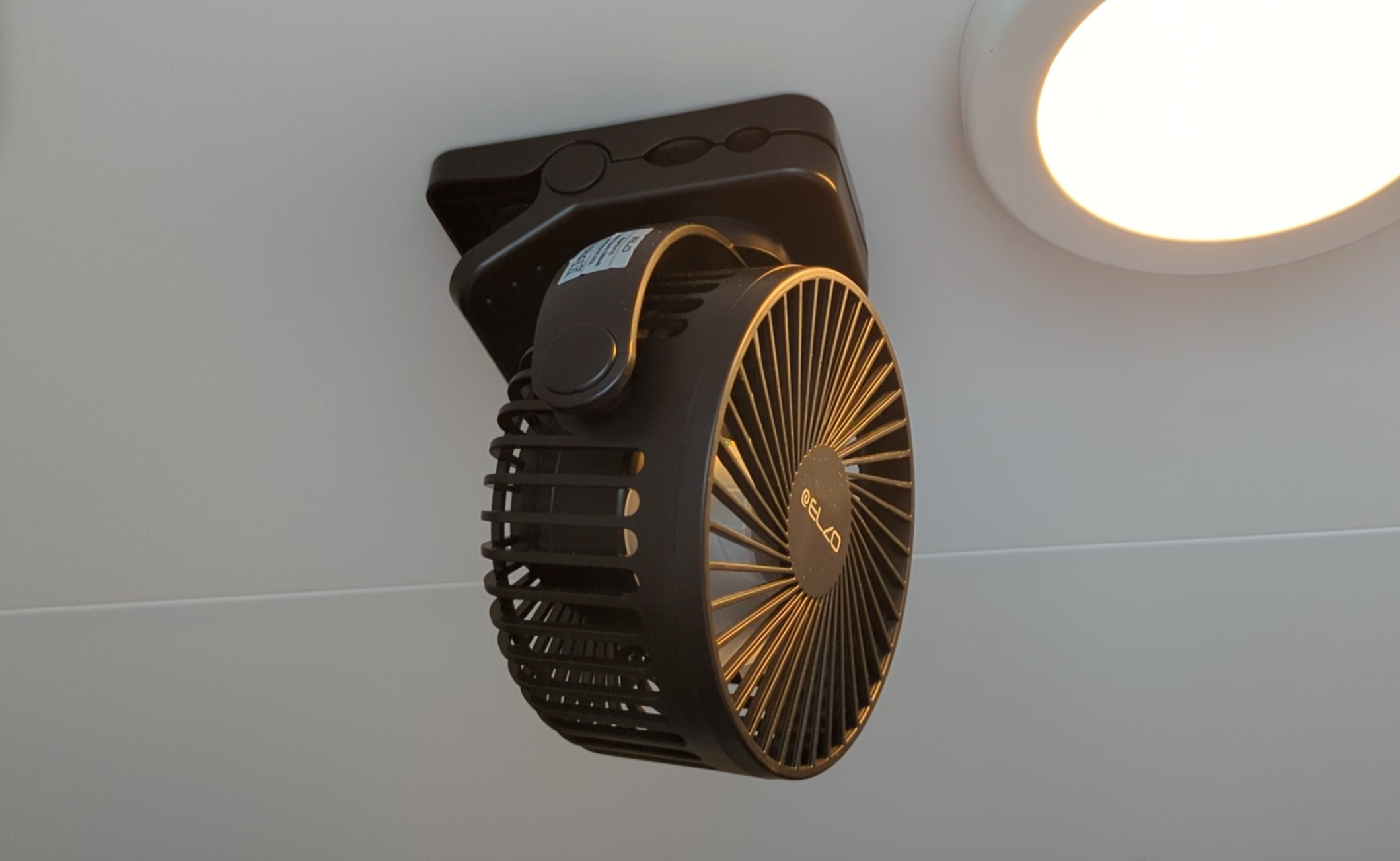 A portable fan that has magnets to stick to the ceiling