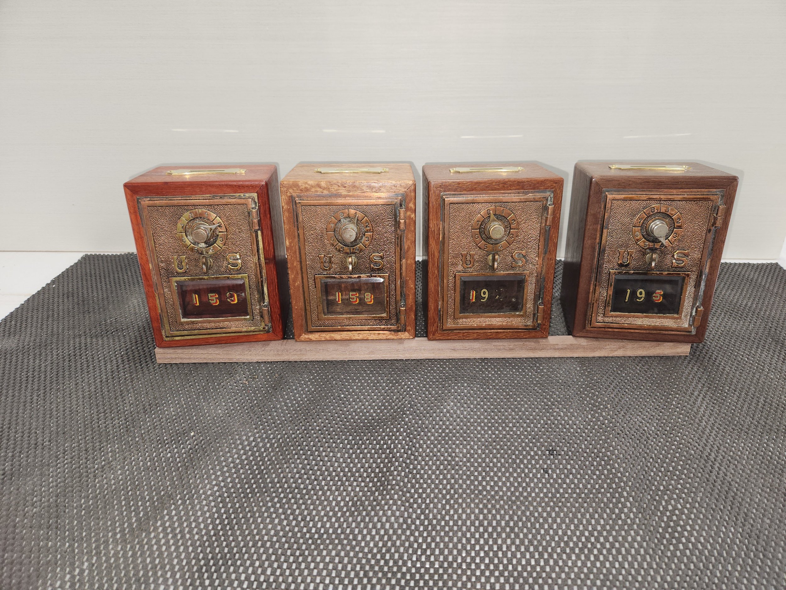 Custom banks using vintage (1906) Post Office Box doors