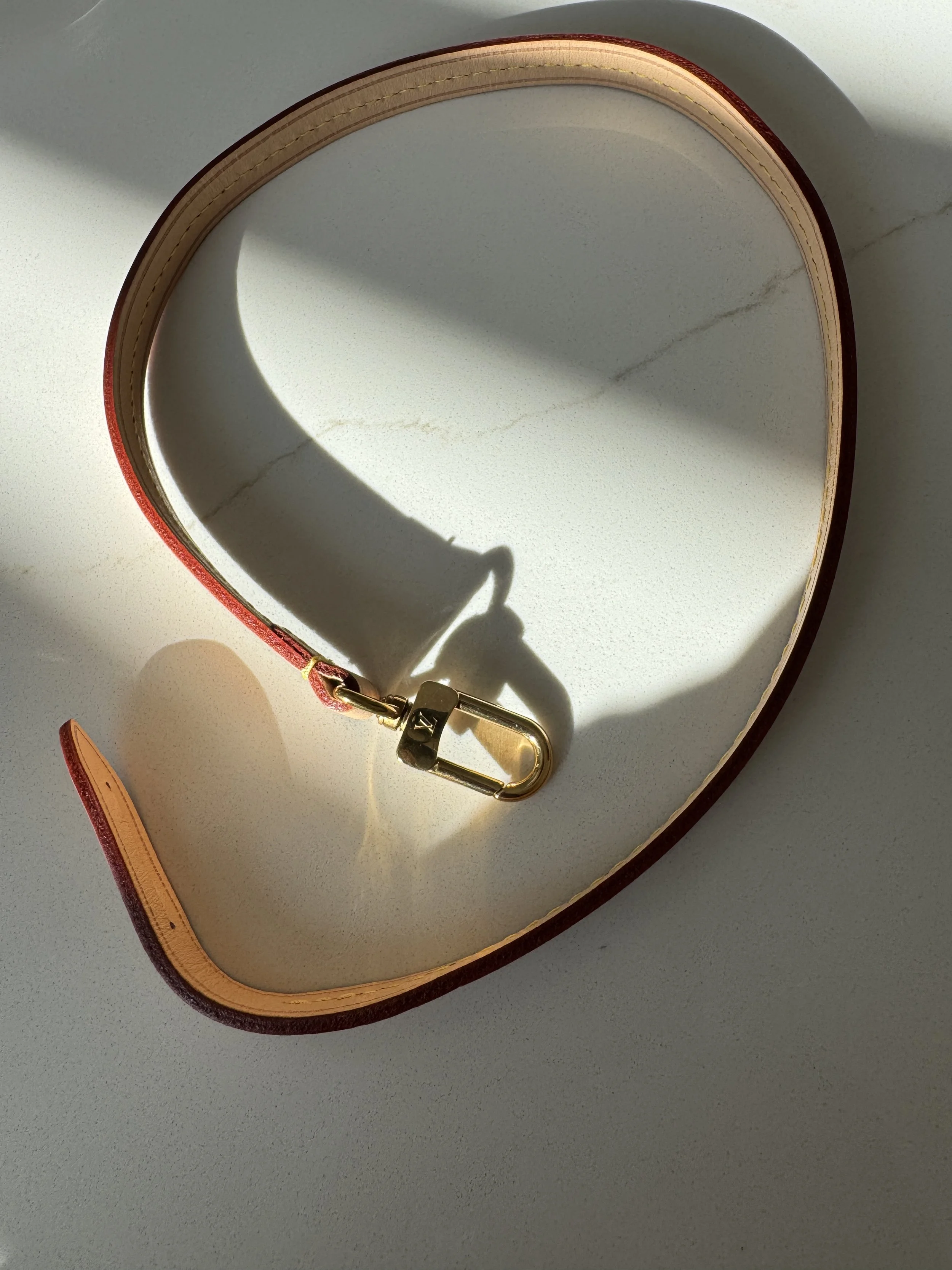 Louis Vuitton Pochette strap in vachetta