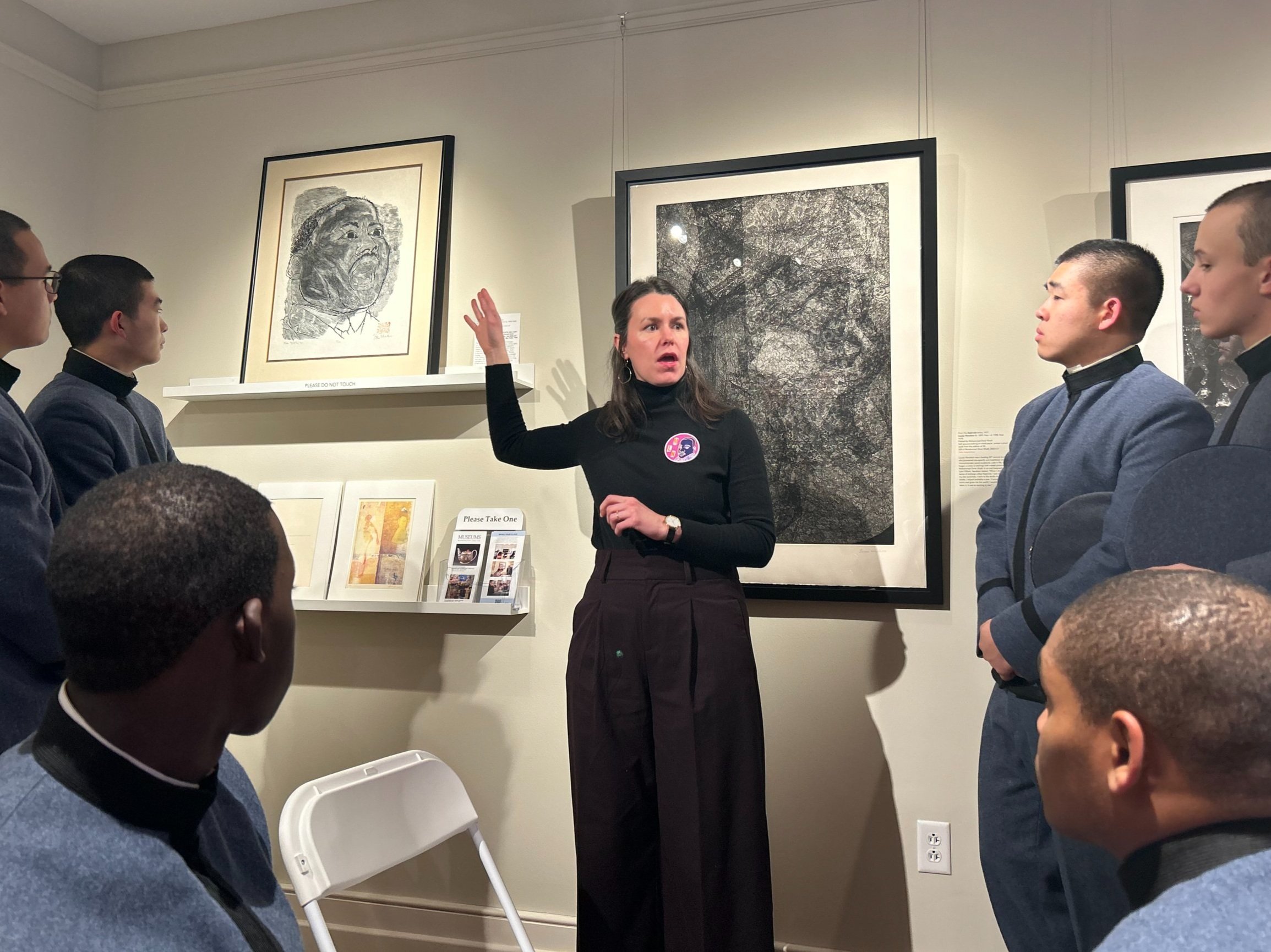  VMI cadets watch Curator Elizabeth Spear describe a famous MLK print on display in Reeves. Source:  The Spectator  