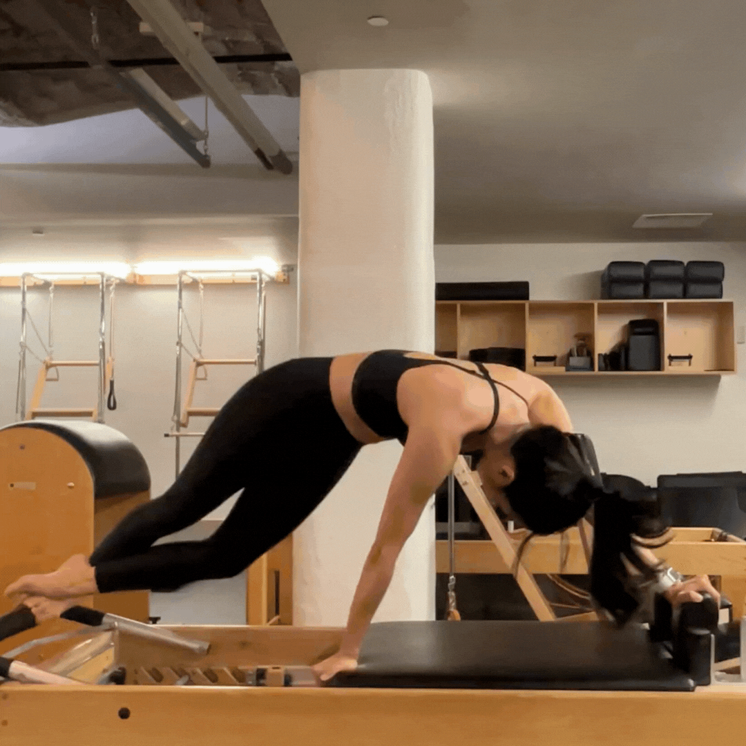 pilates snake and twist on the reformer