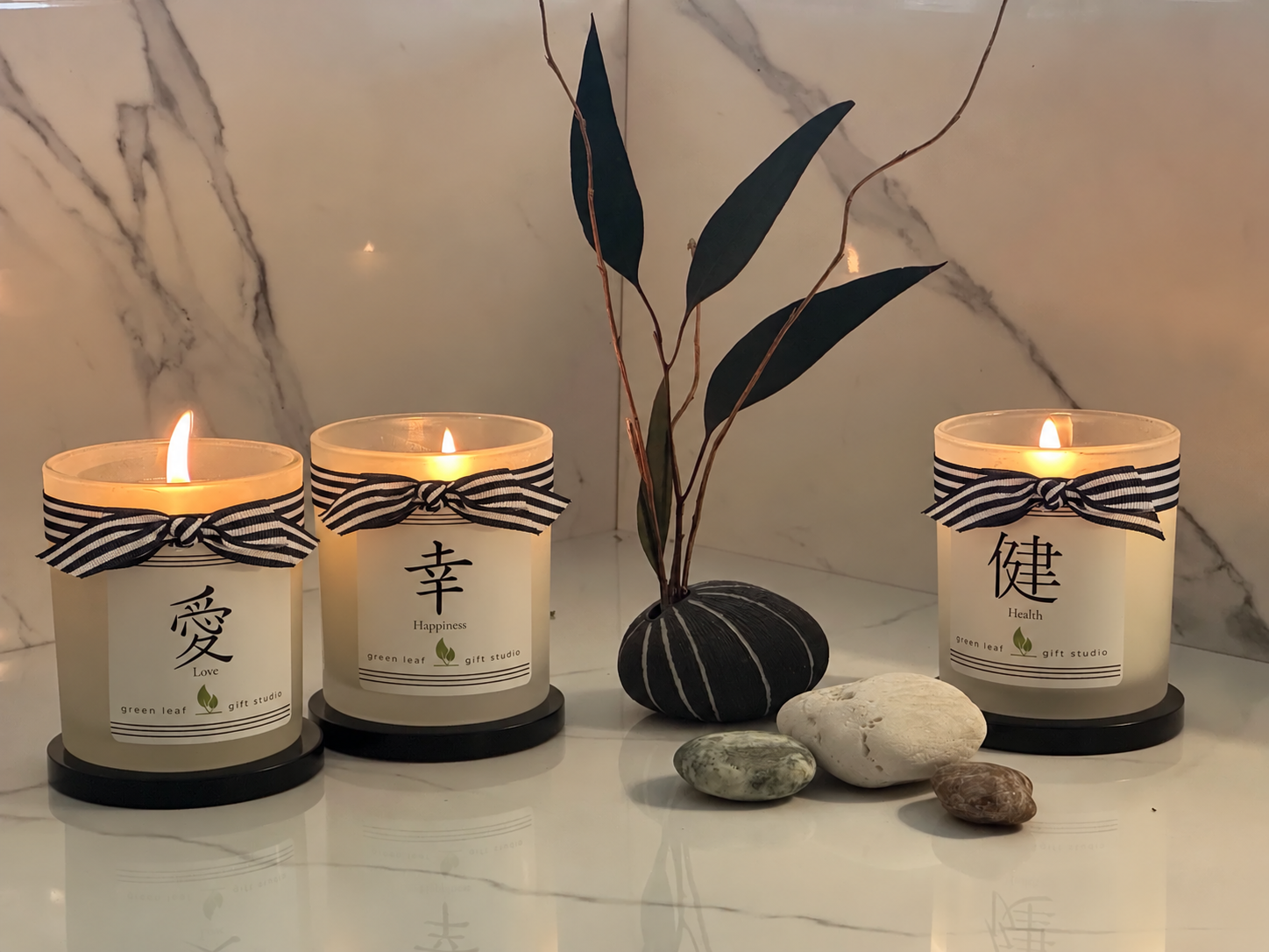 Striped ribbon bows on three candles(1).png