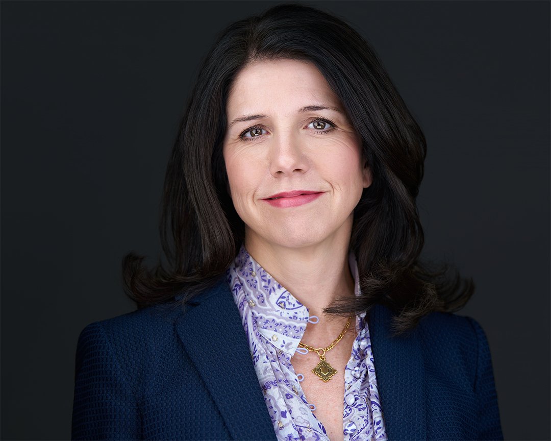 professional headshot of rachel fry wearing navy blazer