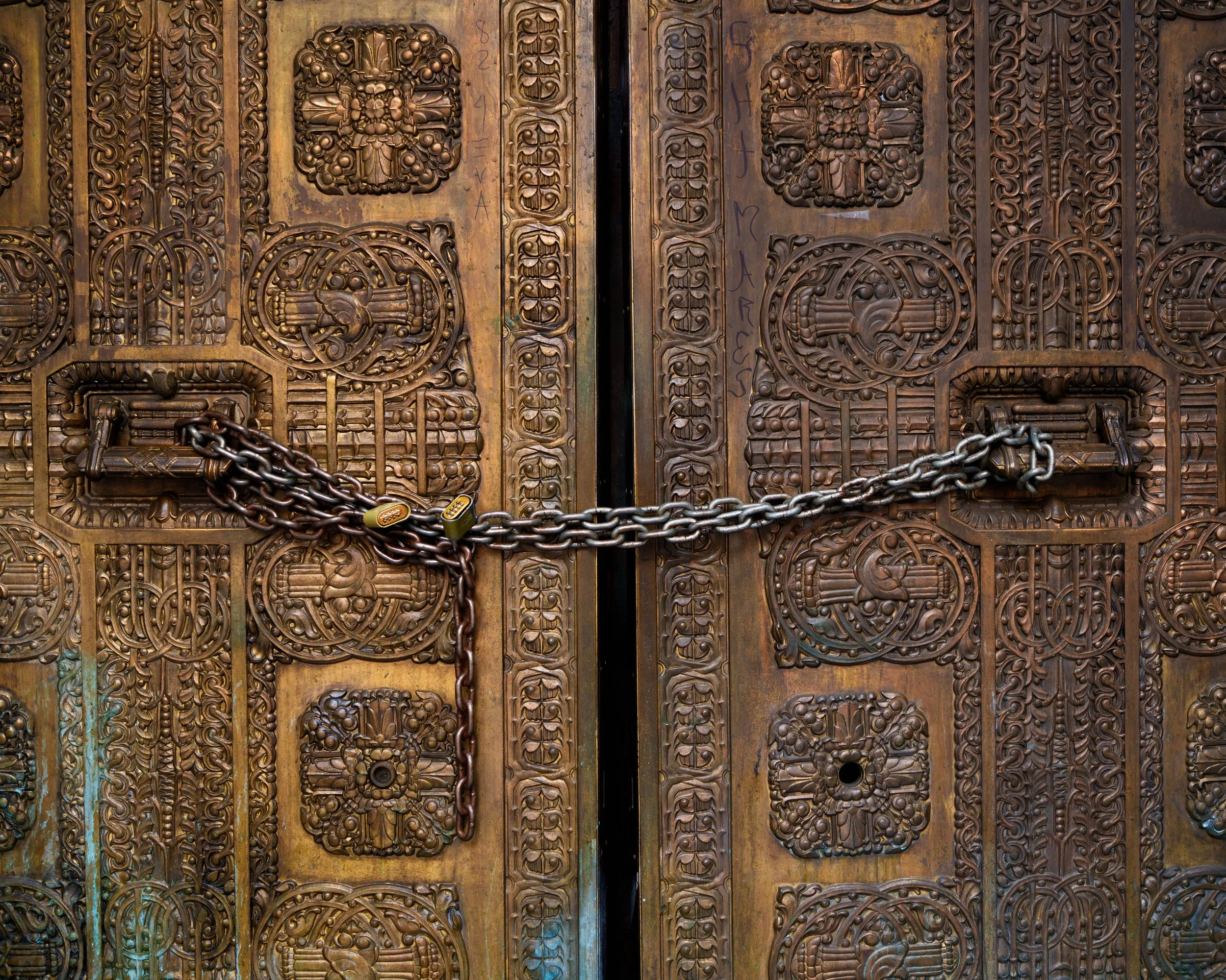 Ornage art-deco gold Doors to the now closed Los Angeles Stock Exchange