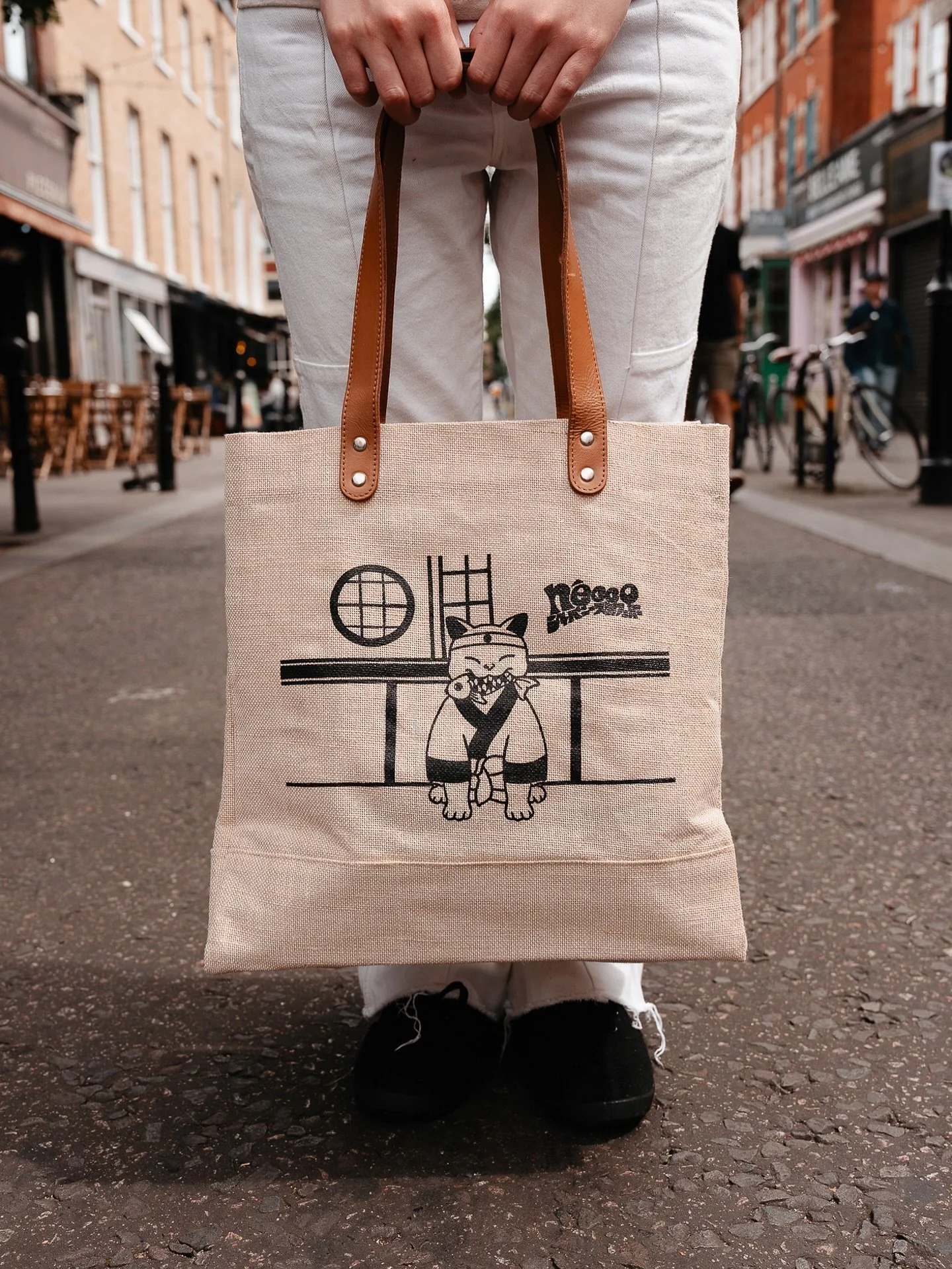 Our signature n&eacute;cco illustration now available on a woven eco bag 🌿🐱
