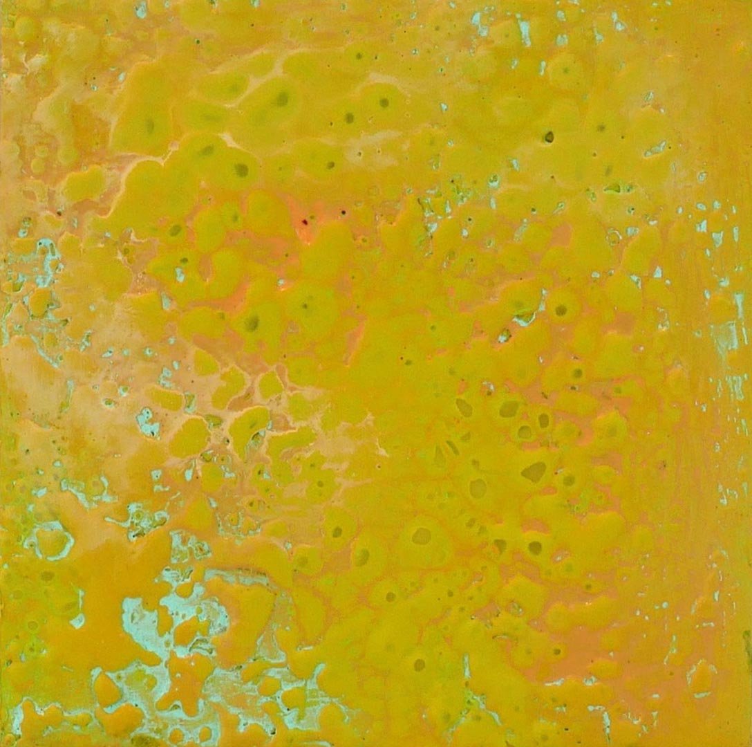Abstract pattern in yellow and orange with hints of blue and pink.