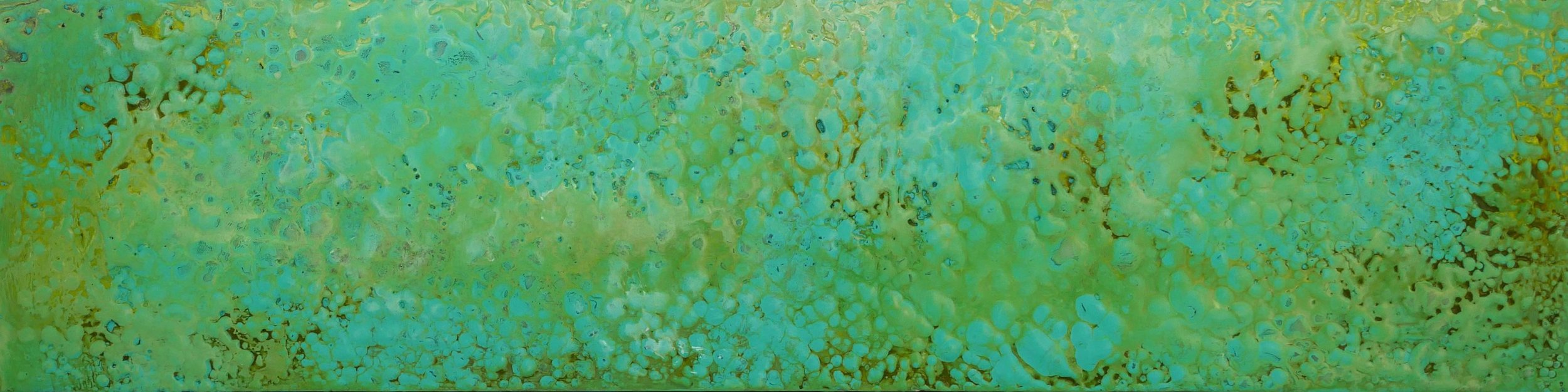 A close-up image of a textured, color-blended surface, predominantly in shades of green and yellow with some blue, suggesting a macro shot of a natural or mineral surface.