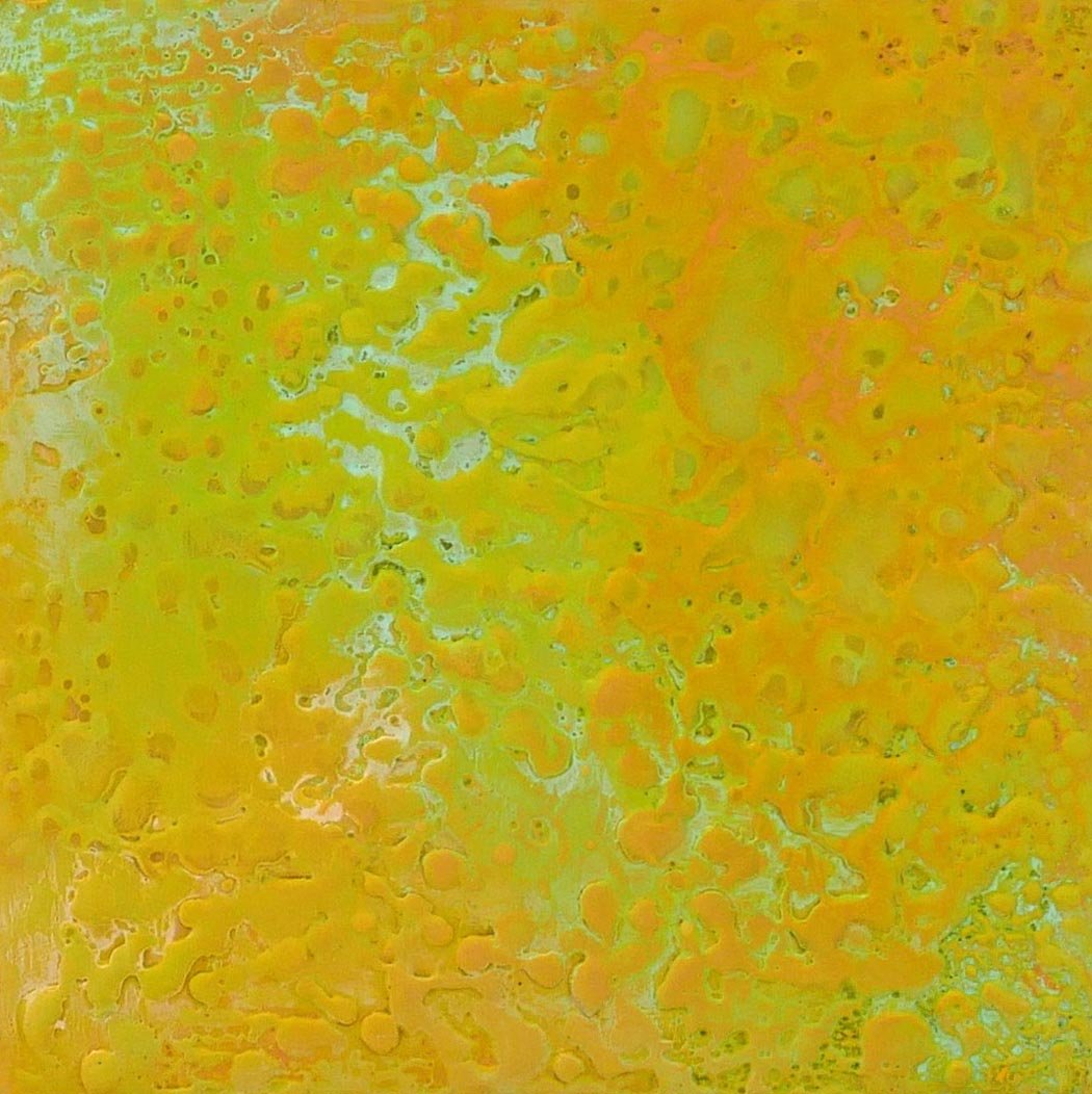 Abstract pattern with yellow, orange, and green colors, resembling a marbled or liquid surface.