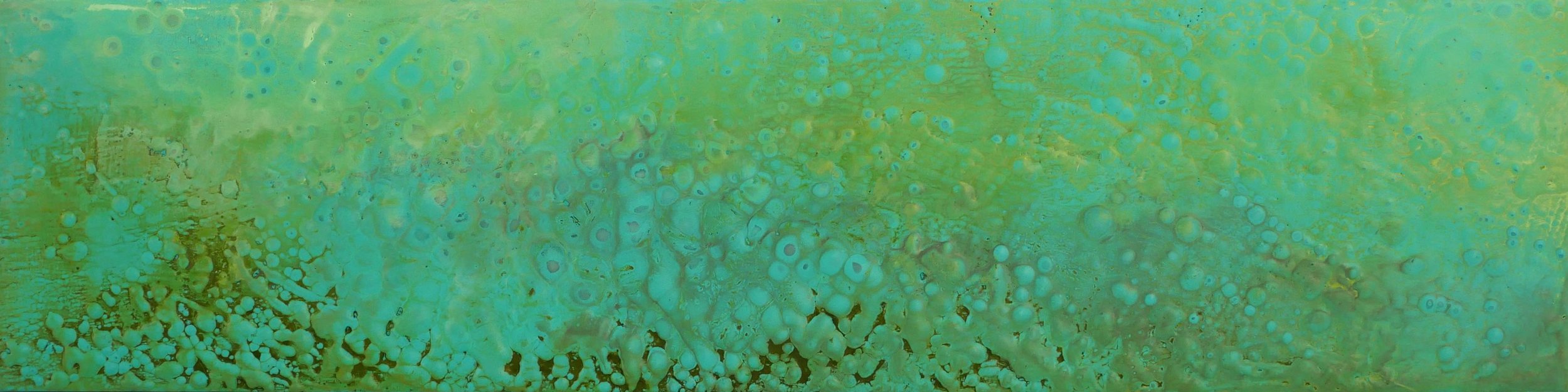 Close-up of a colorful, abstract surface with bubbles and textures in shades of green, blue, and yellow.