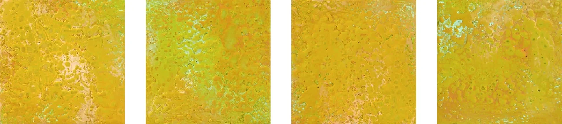 Four abstract yellow and orange textured paintings with hints of green and black specks.