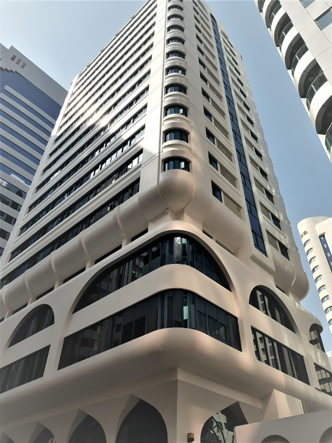 Modern high-rise building with curved architectural design