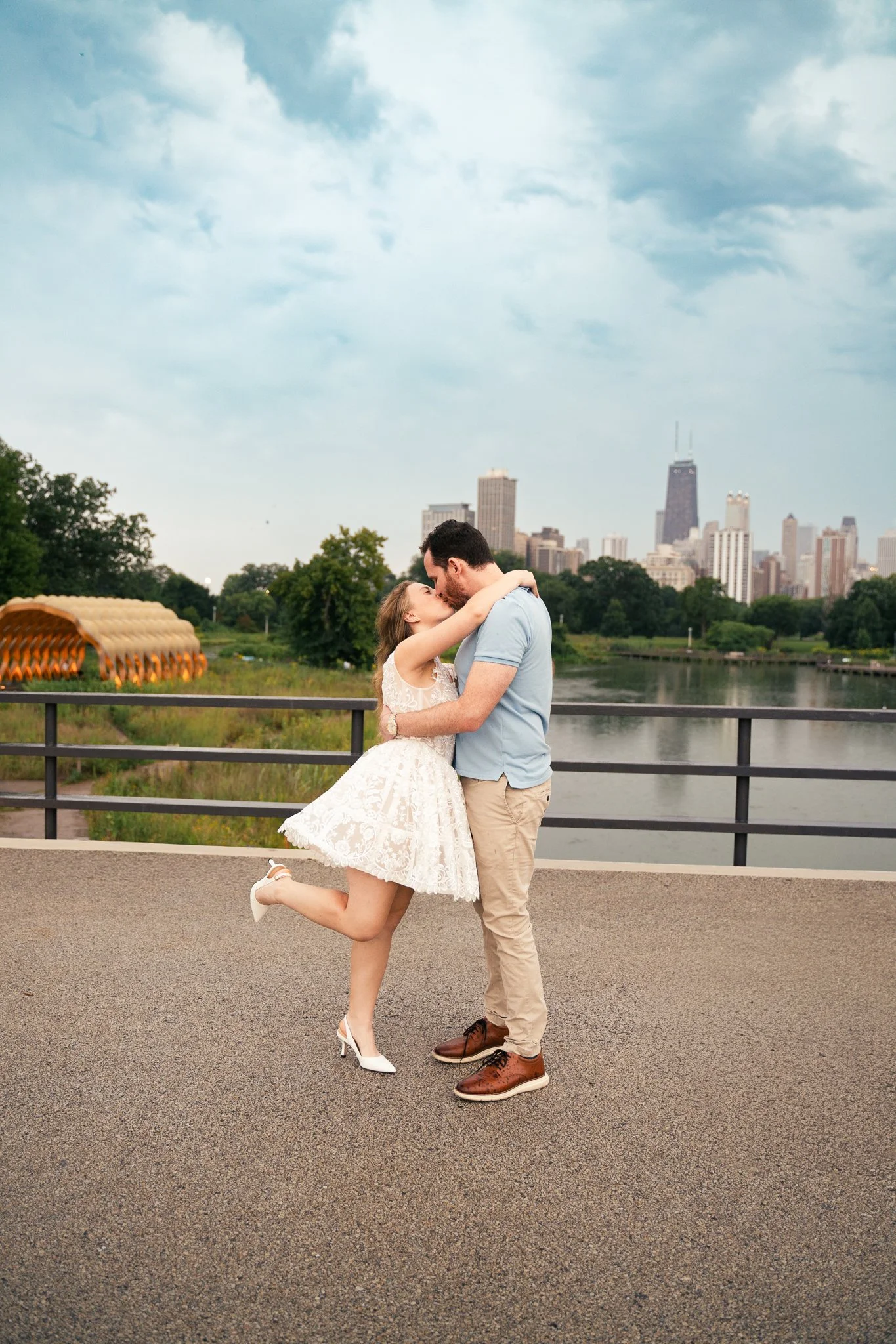 Lincoln Park Chicago Illinois Engagement Photographer | Bride in lace white dress holding on to grooms arm, Honeycomb in background | Midwest Wedding and Engagement Photography Sessions