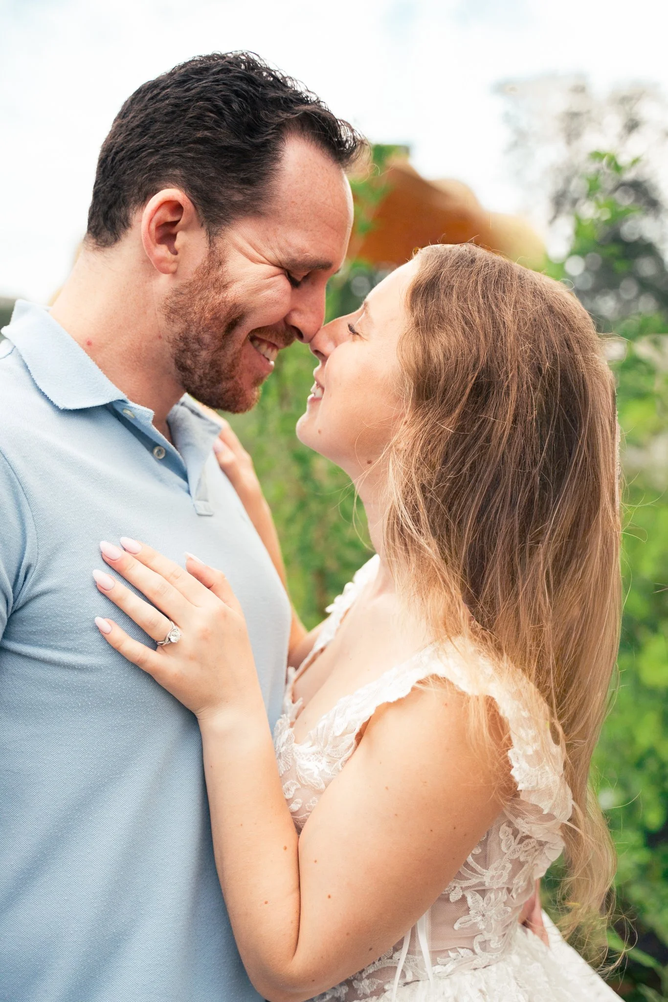 Lincoln Park Chicago Illinois Engagement Photographer | Bride in lace white dress kissing groom with engagement ring resting on his chest Honeycomb in background | Midwest Wedding and Engagement Photography Sessions