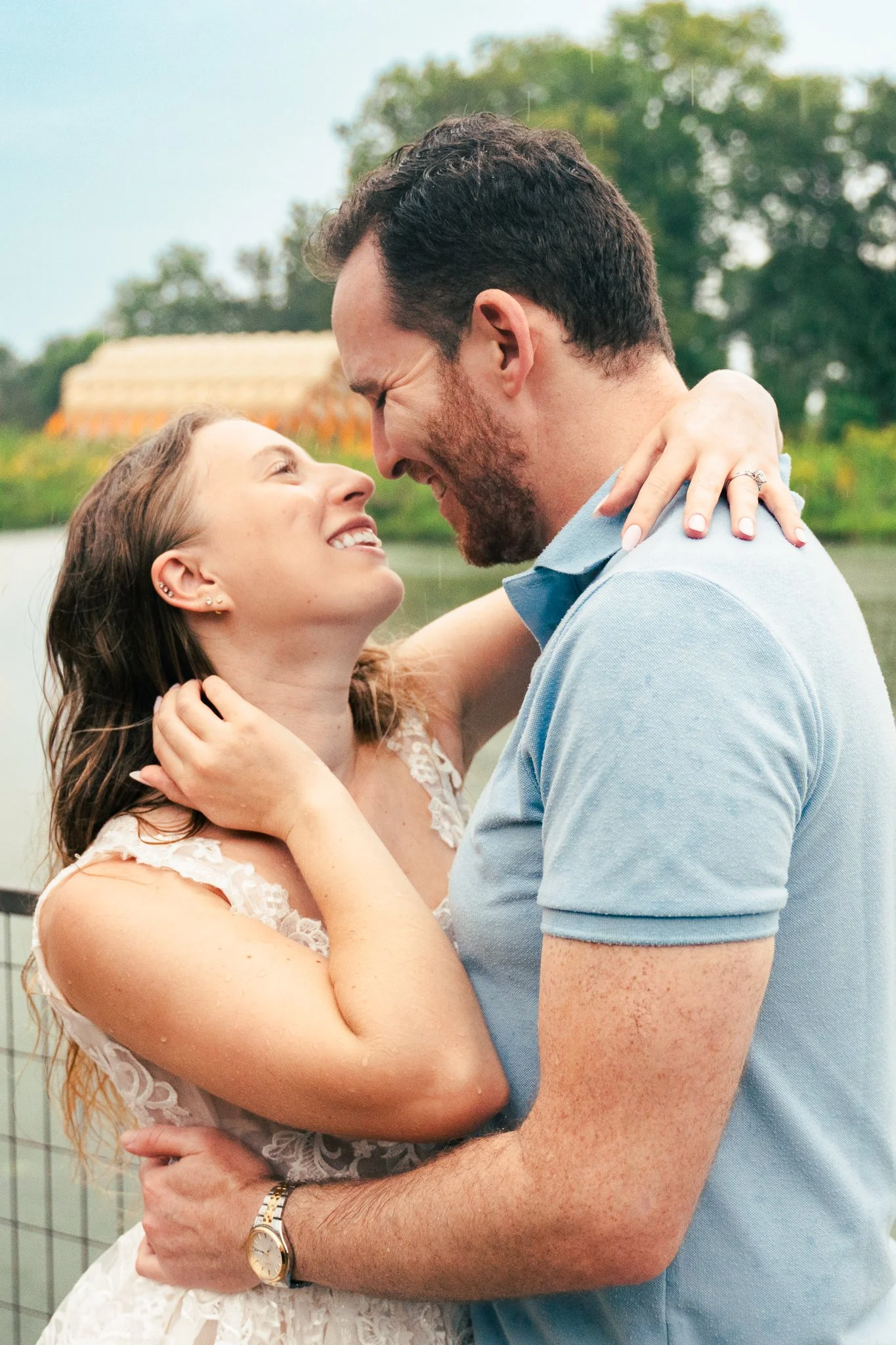 Lincoln Park Chicago Illinois Engagement Photographer | Bride in lace white dress holding on to grooms arm, Honeycomb in background | Midwest Wedding and Engagement Photography Sessions