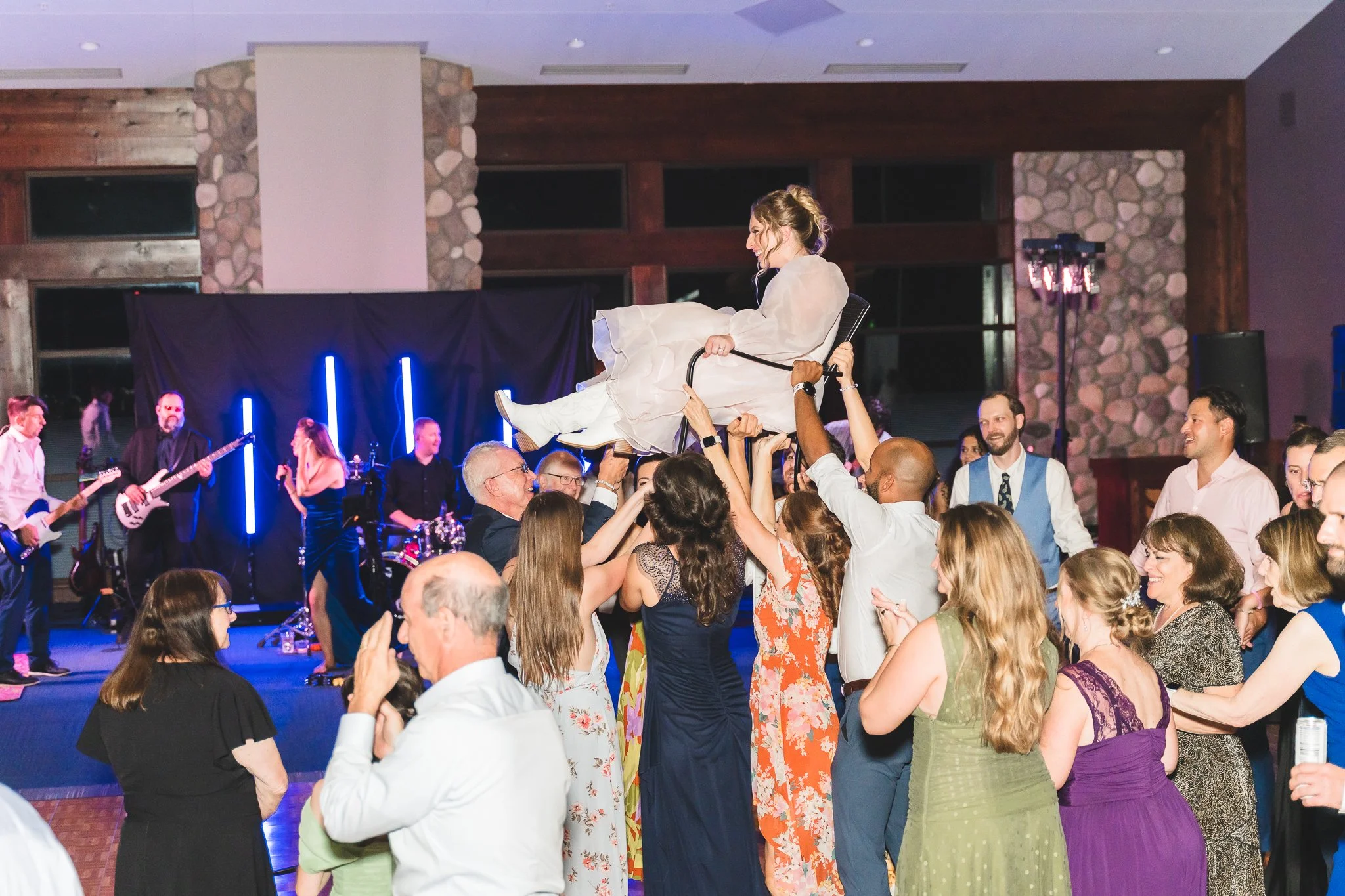 milwaukee_madison_wisconsin_wedding_photographer_osrui_wedding_reception_the_hora_bride_on_chair_high.jpg