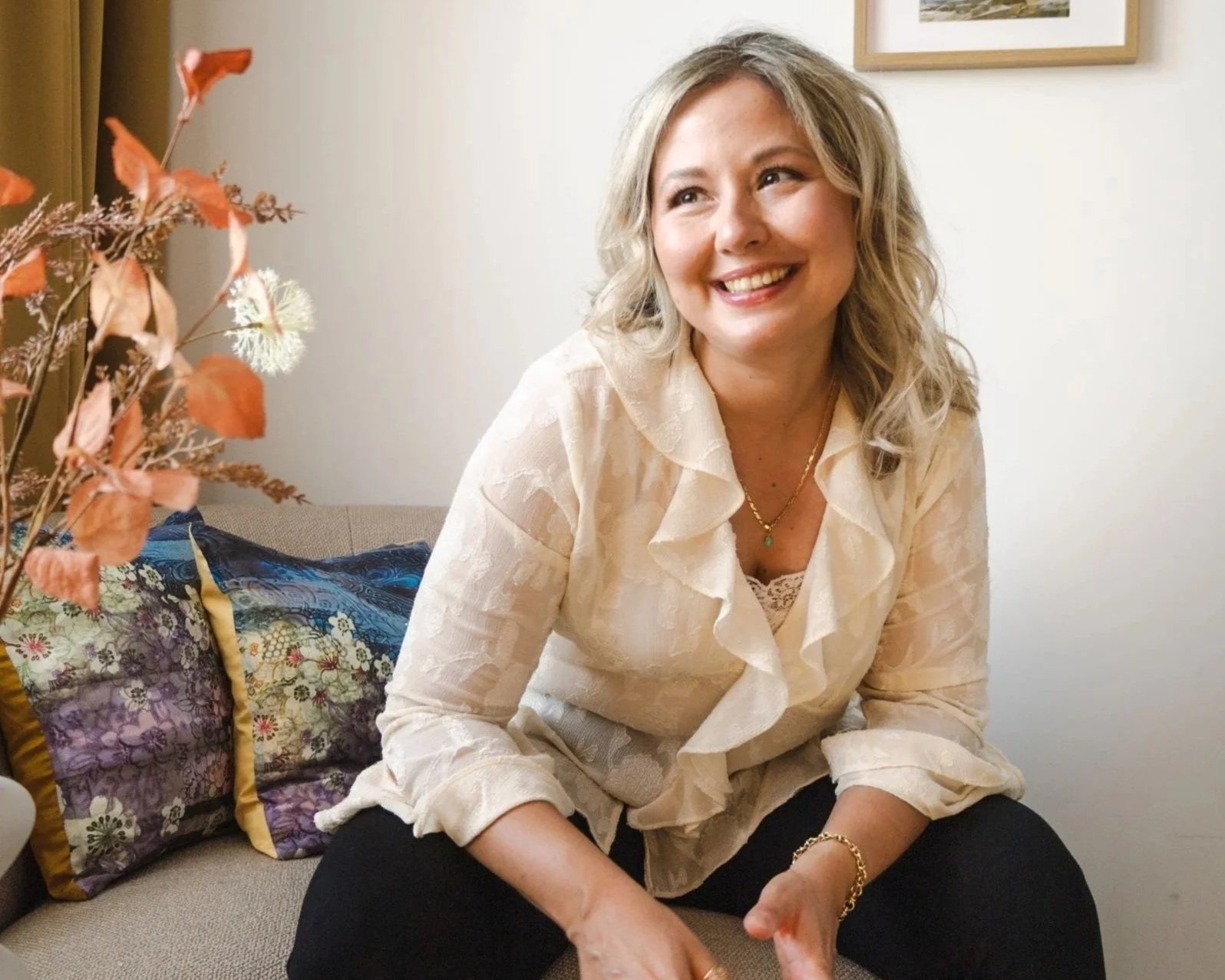 Roberta Basili, expat career coach and former recruiter, smiling in her cozy home office coaching setting.
