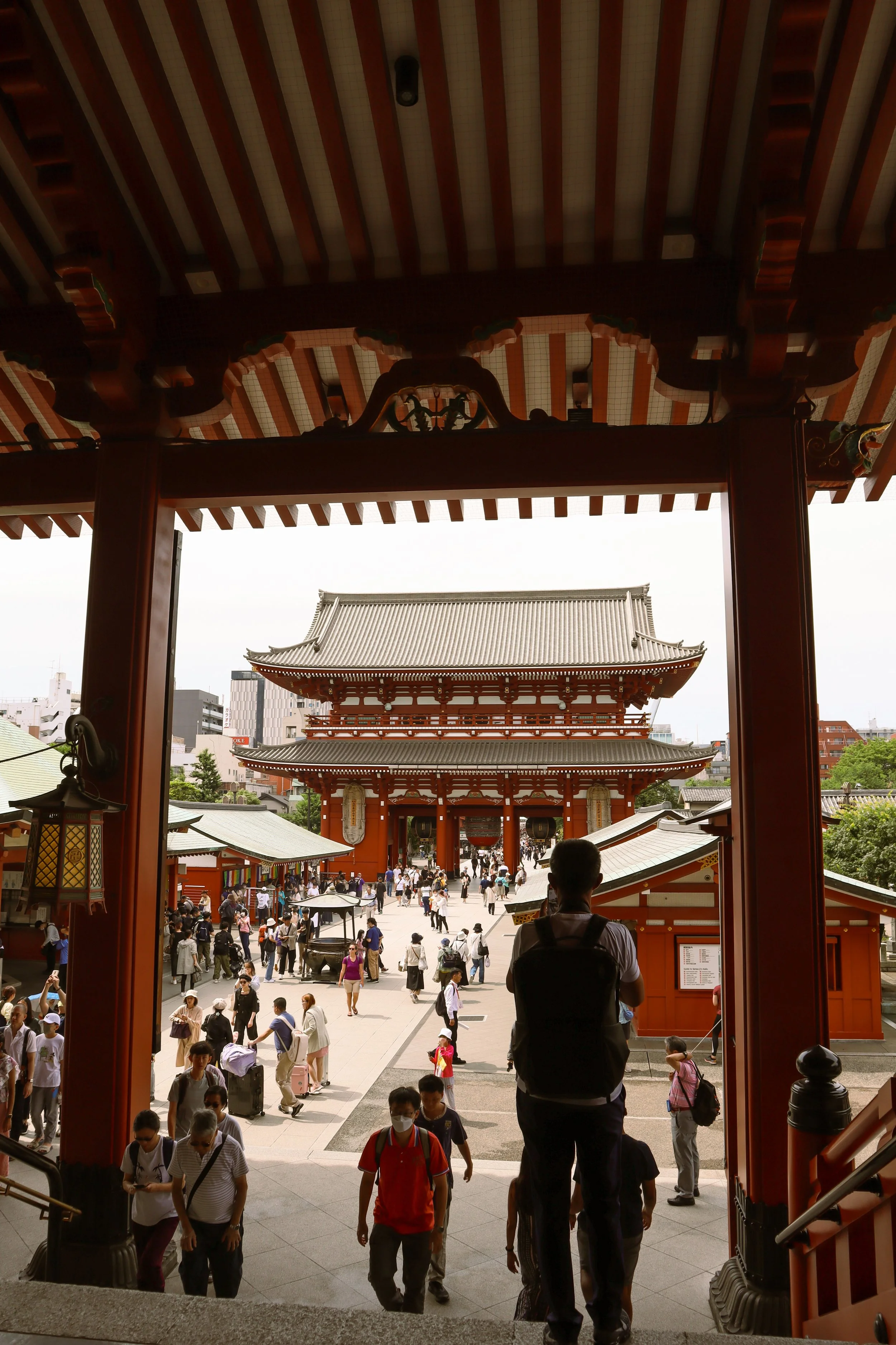 Key stop on 48-hour Tokyo itinerary. Senso-ji Temple, Tokyo, Japan. Kaminarimon Gate with red lantern, Nakamise shopping street, historic pagodas, and traditional architecture
