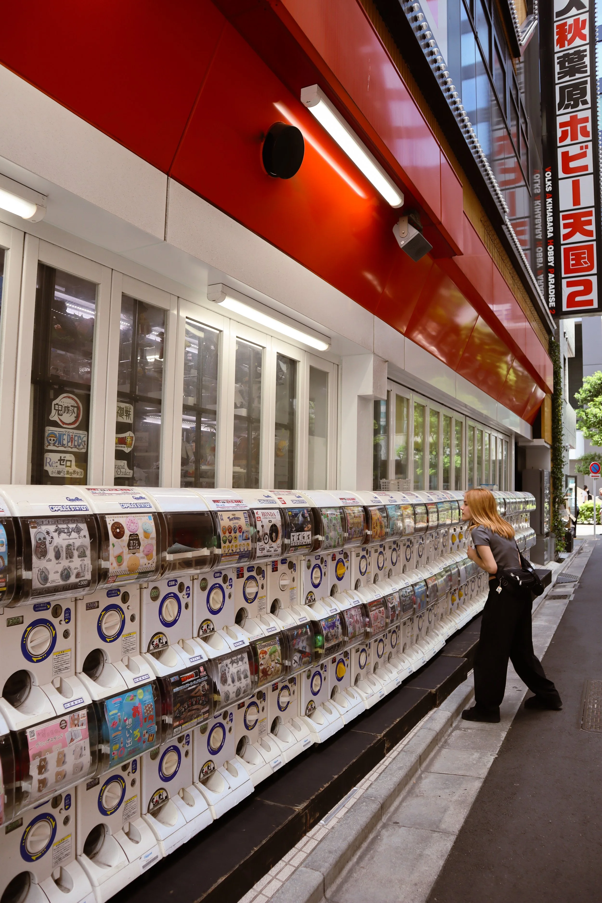 Key stop on 48-hour Tokyo itinerary. Gachapon games in Akihabara, Tokyo, Japan. Colorful vending machines with toys, figurines, and collectibles, popular among tourists and anime fans.