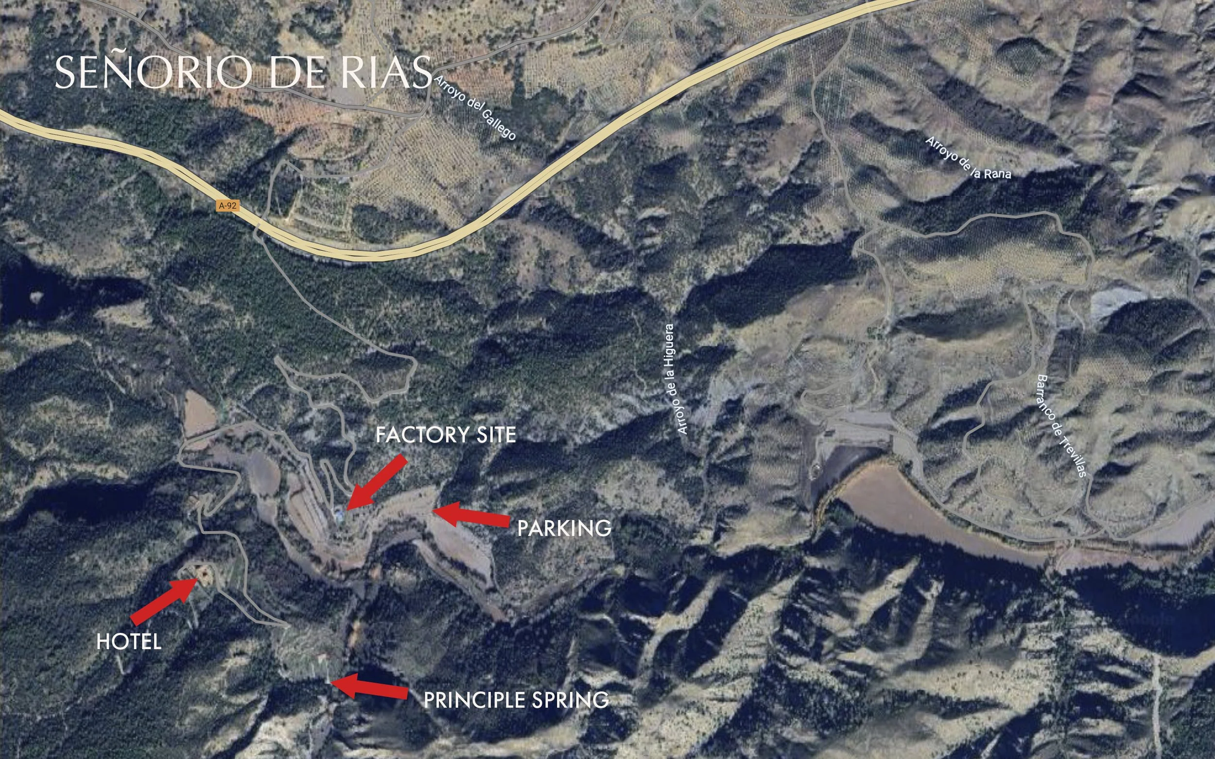 Satellite map of the Senorio de Rias area showing roads, a factory site, parking, a hotel, and principal spring, with labels for natural and man-made features.