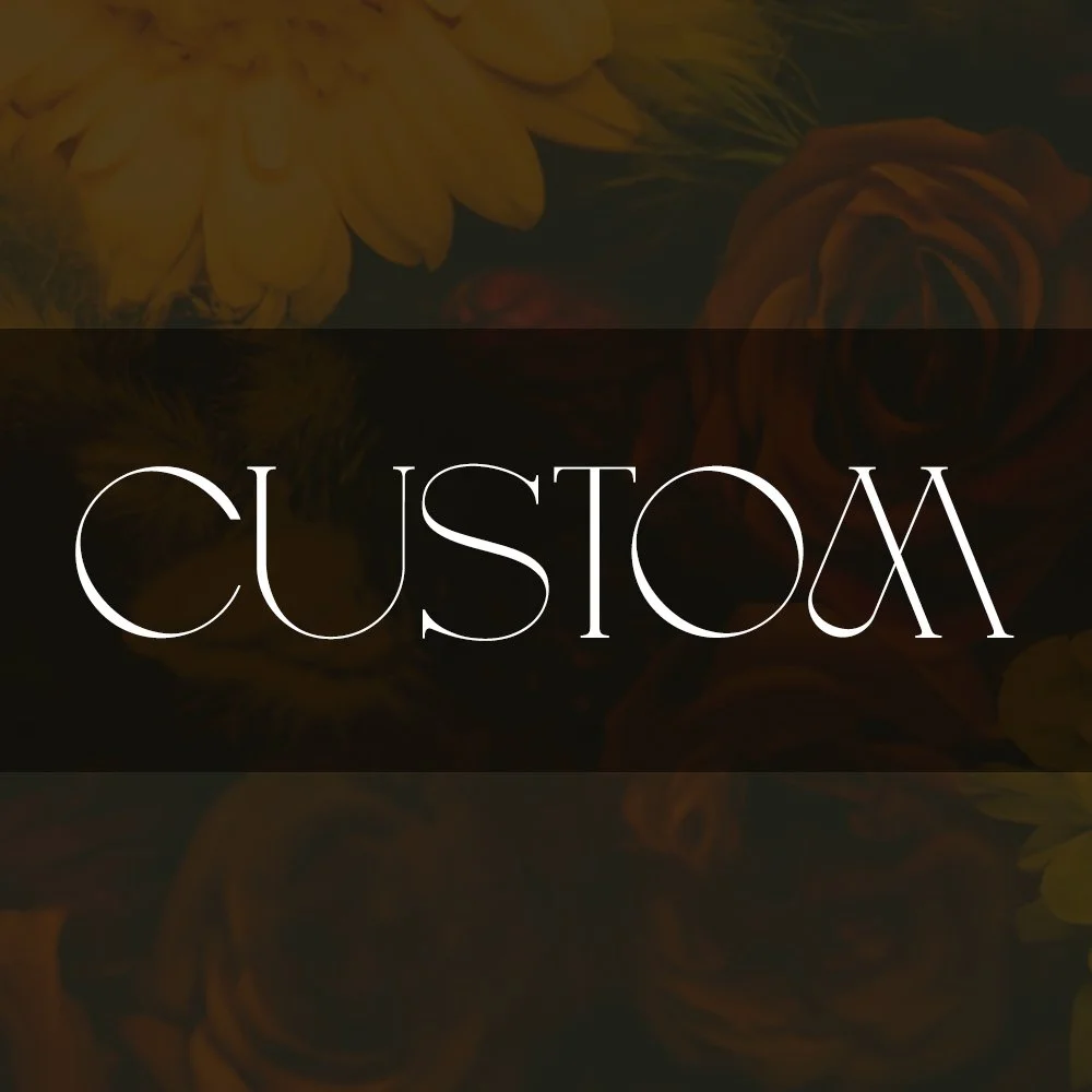 The image features the word 'CUSTOM' written in elegant, white cursive font over a dark background with faint floral patterns, including yellow and orange flowers.