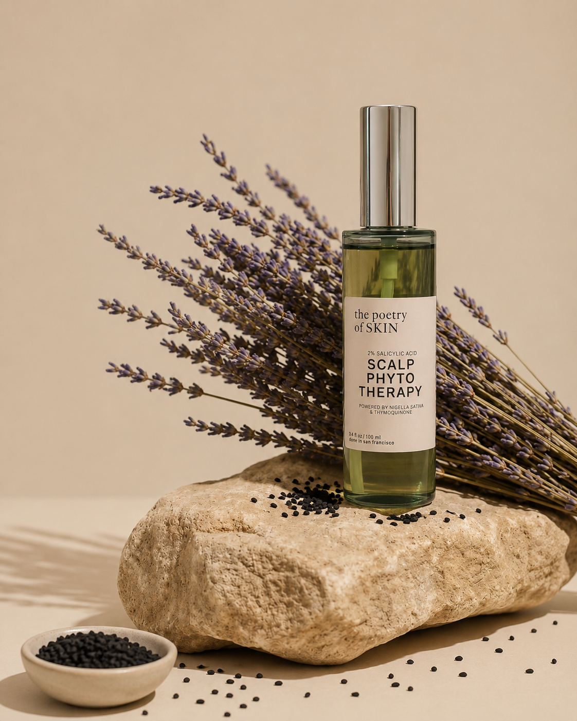 Poetry of Skin Phyto Scalp Therapy scalp oil styled with dried lavender and Nigella sativa black seeds on a natural stone surface