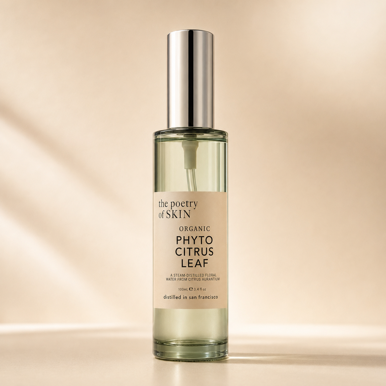 close-up bottle, dark background  Phyto Citrus Leaf Distillate by Poetry of Skin — organic bitter orange leaf hydrosol in glass spray bottle, single-ingredient pH-balancing toner