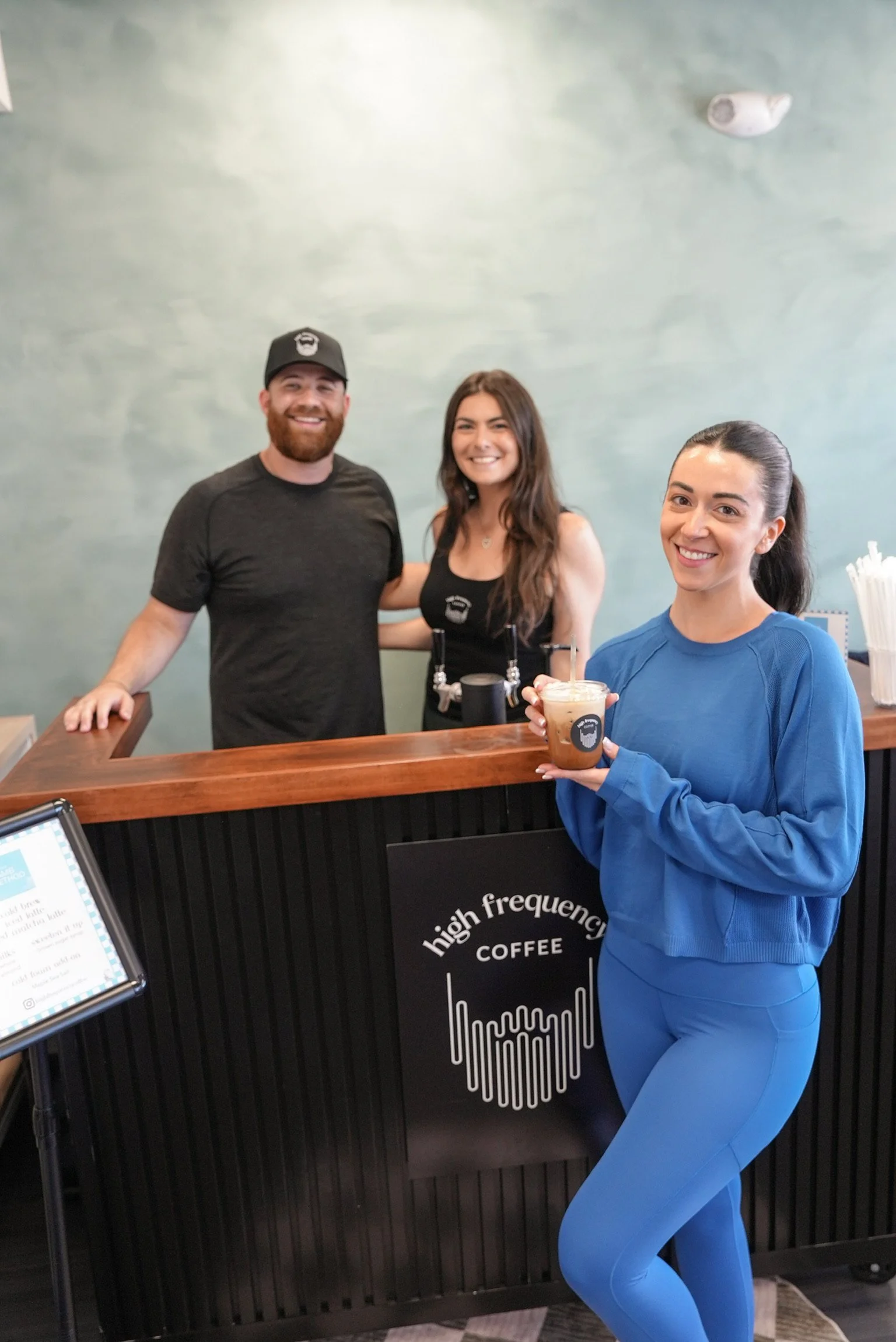 High Frequency Coffee event catering setup featuring a custom mobile coffee cart and specialty drink menu