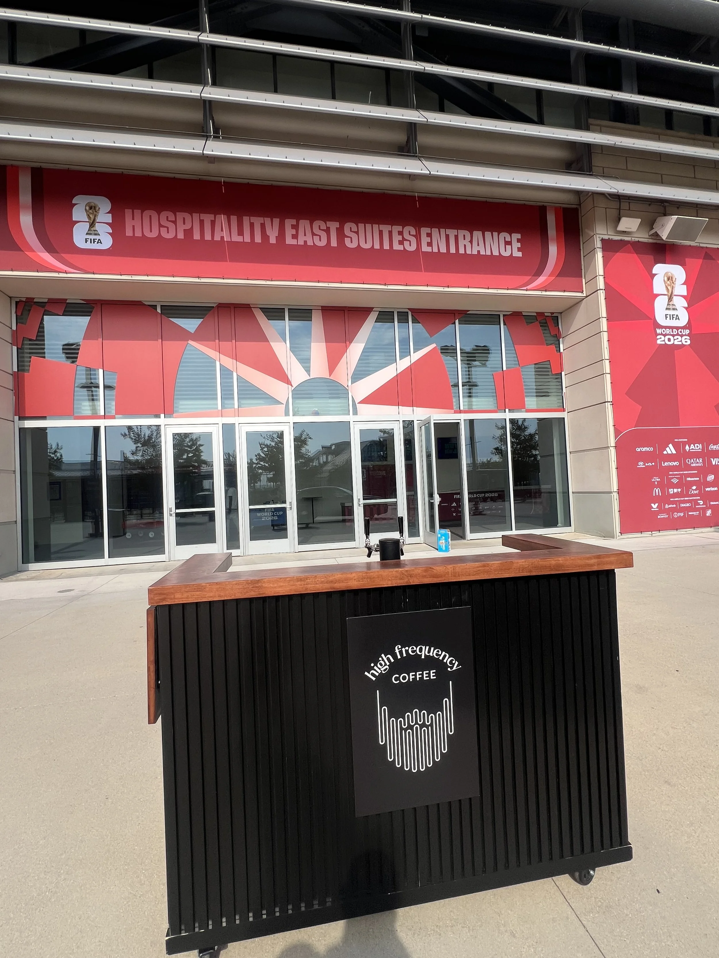 High Frequency Coffee event catering setup featuring a custom mobile coffee cart and specialty drink menu