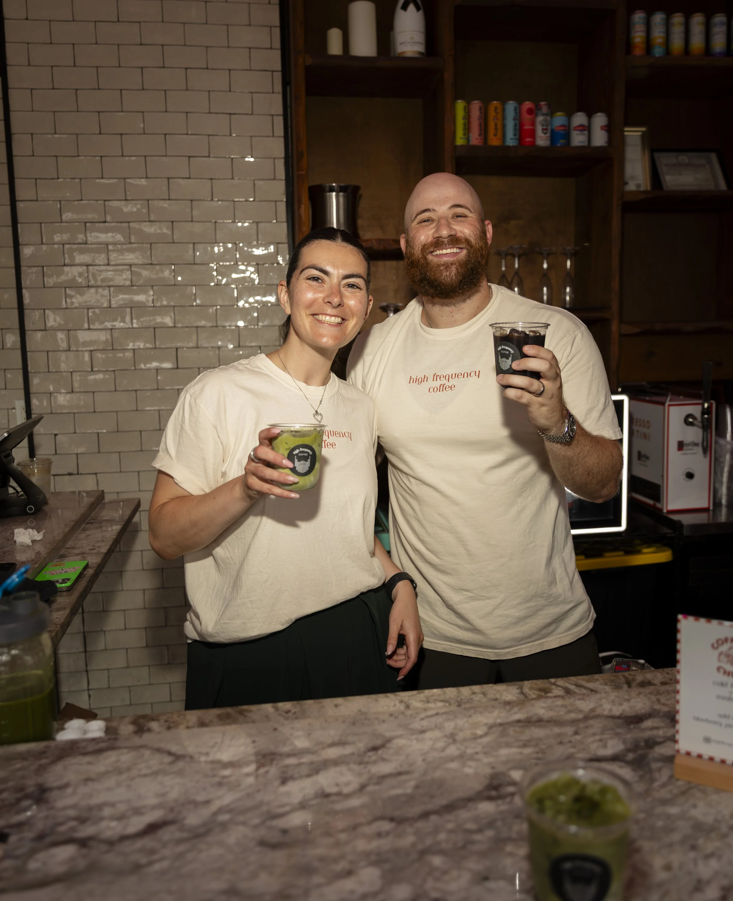 Guests enjoying handcrafted cold brew and specialty coffee drinks from the High Frequency Coffee cart