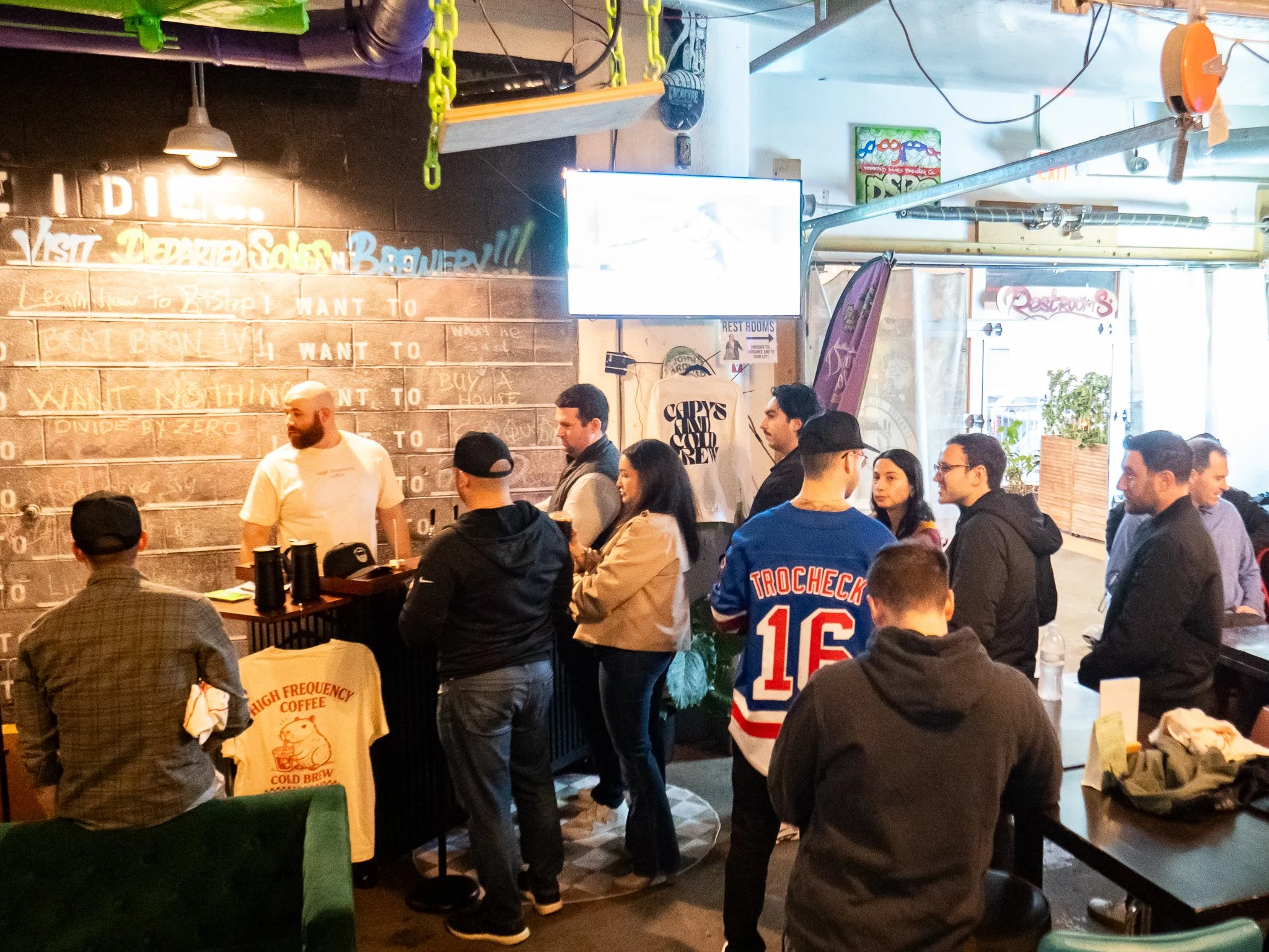Guests are enjoying their experience, hovering around the coffee catering cart.