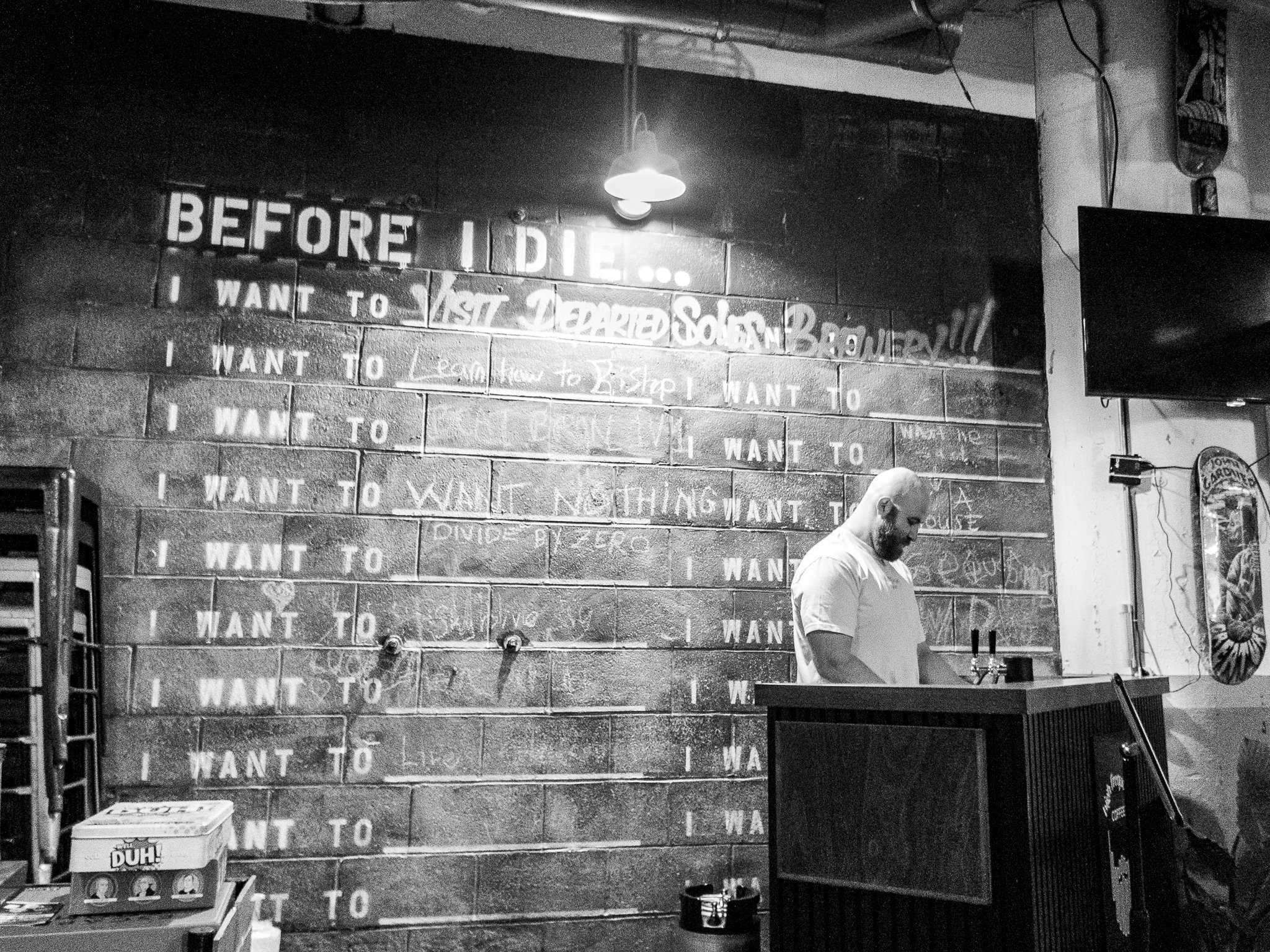 A scenic picture of the founder perfecting his coffee craft behind the bar.