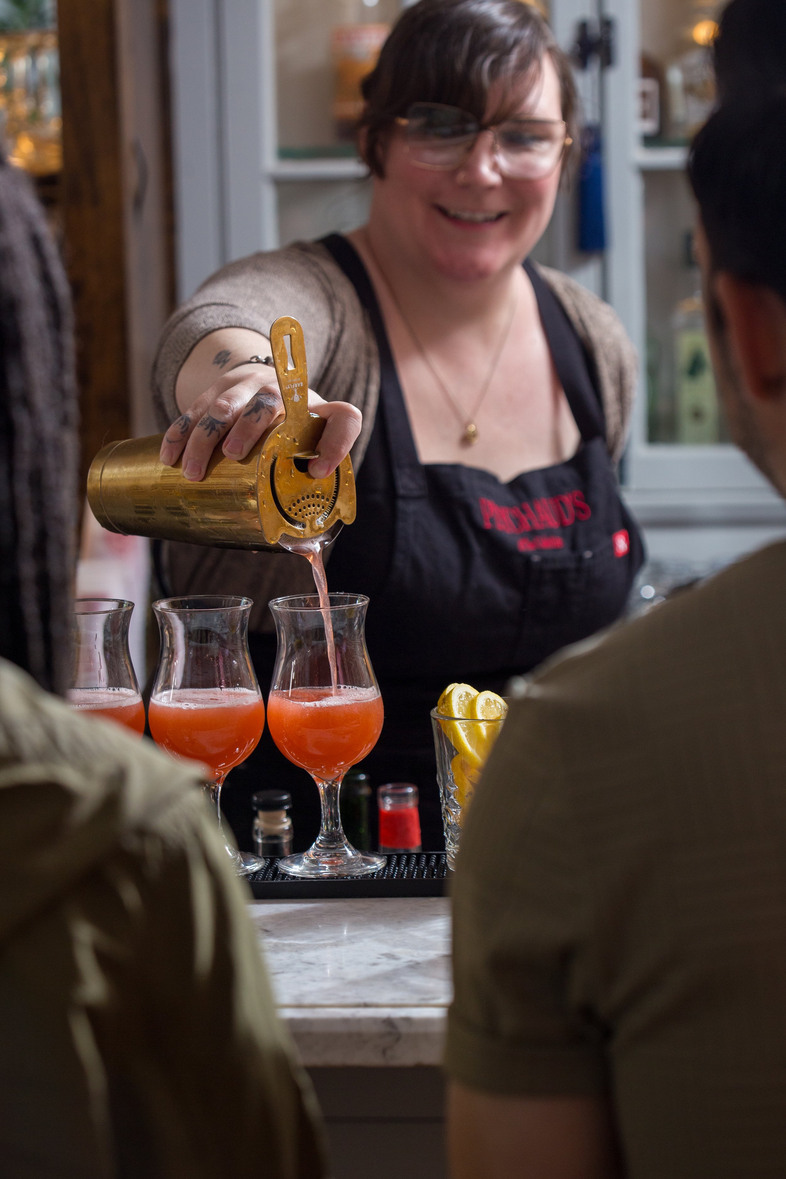 Cocktail class at Peychaud’s featuring a bartender making a classic Hurricane at The Celestine hotel