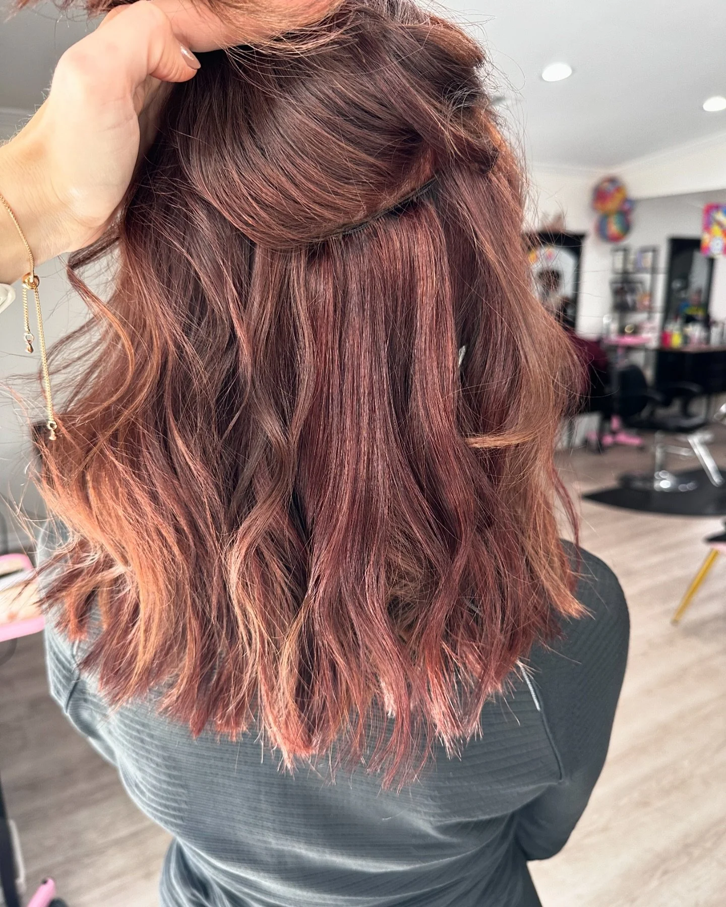 One row of custom colored, hand tied extensions 🍷