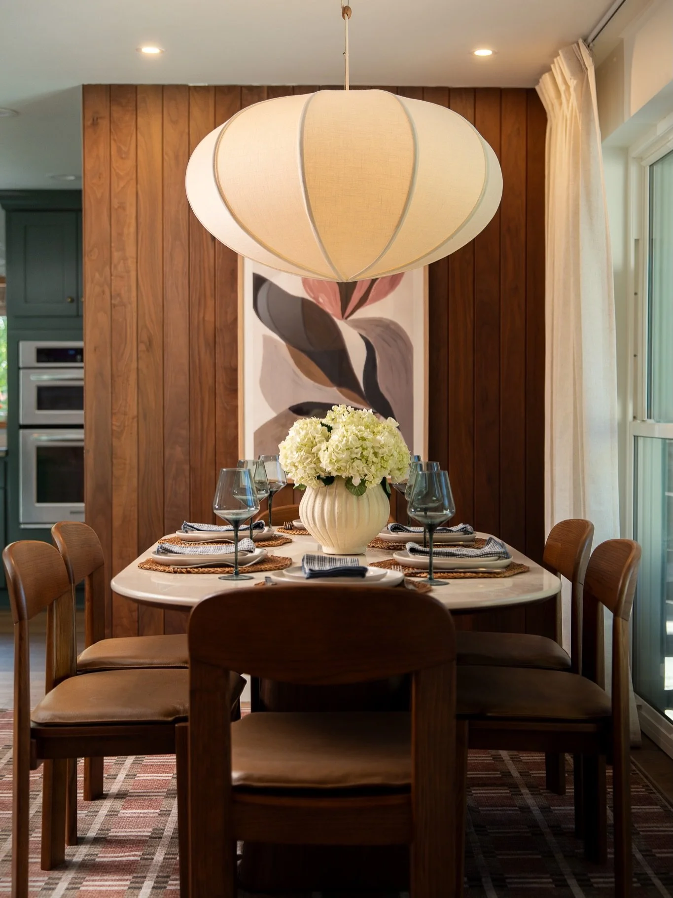 The details are where a space actually lives. 🤎

Going back through this Fort Lauderdale shoot and the small moments are what stuck with me &mdash; the burnt-orange sconces glowing over open shelving, a chess set caught in afternoon light, vinyl rec