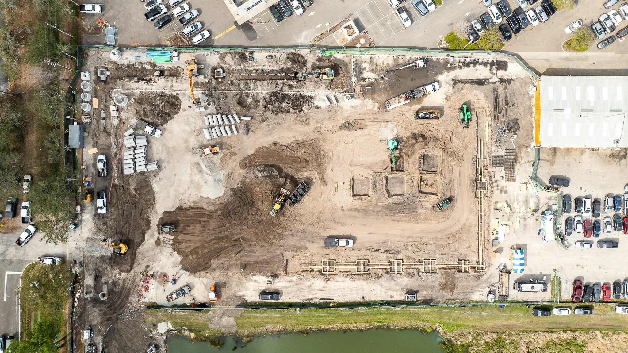 Aerial drone view of an active South Florida commercial construction site showing site progress, parcel size, and surrounding context