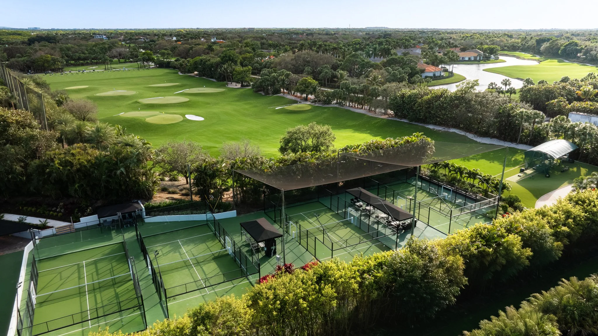 Aerial drone view of South Florida country club golf course with fairways, sand traps, and water hazards — aerial photography for architects and developers by Adam J Tanner