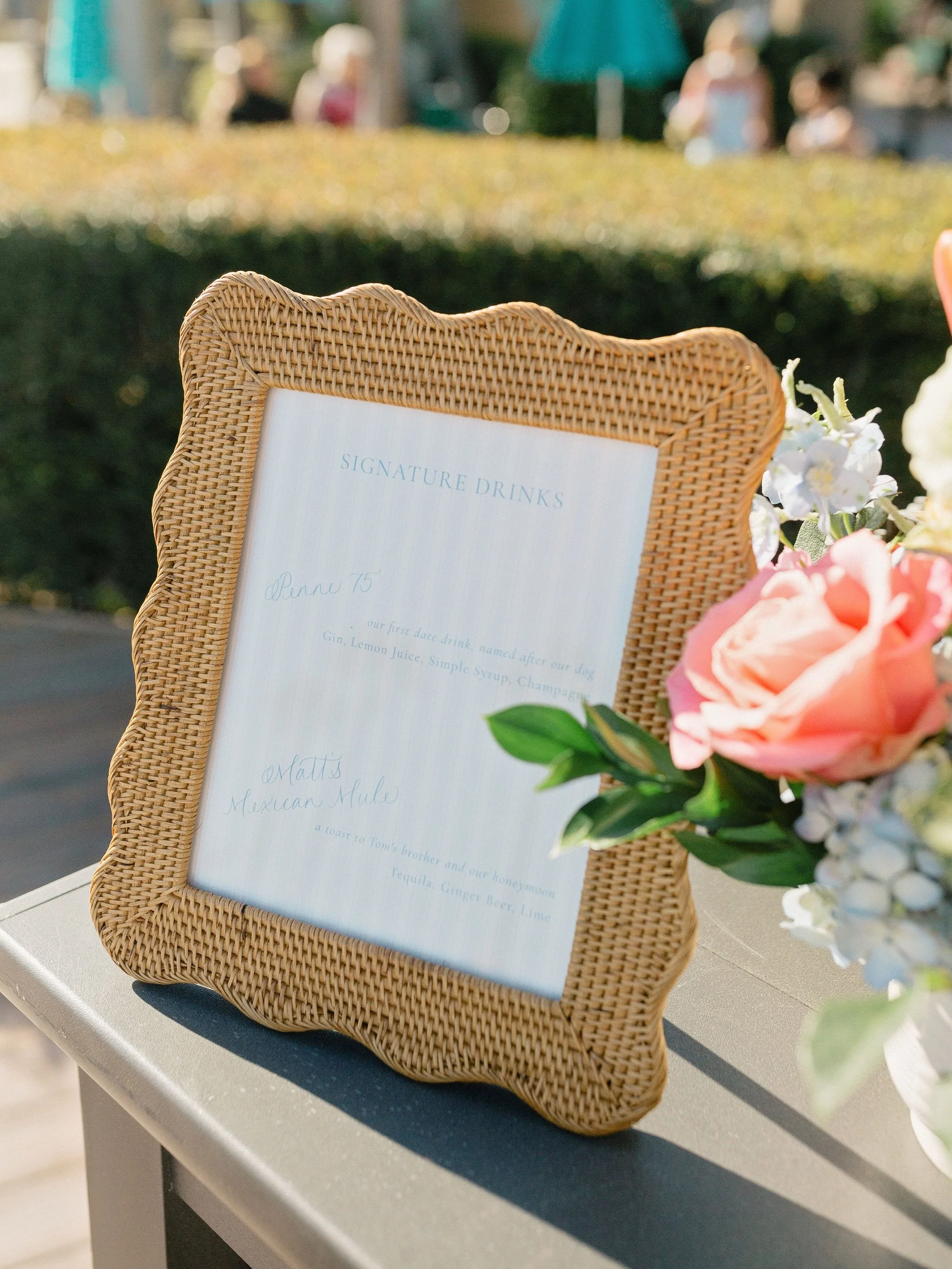 A&amp;T&rsquo;s bar signs were one of my favorite day-of pieces we created. We tied in texture and pattern from their suite by sourcing wavy rattan frames and bringing back the coastal ticking stripes. Each drink was both selected and named with inte