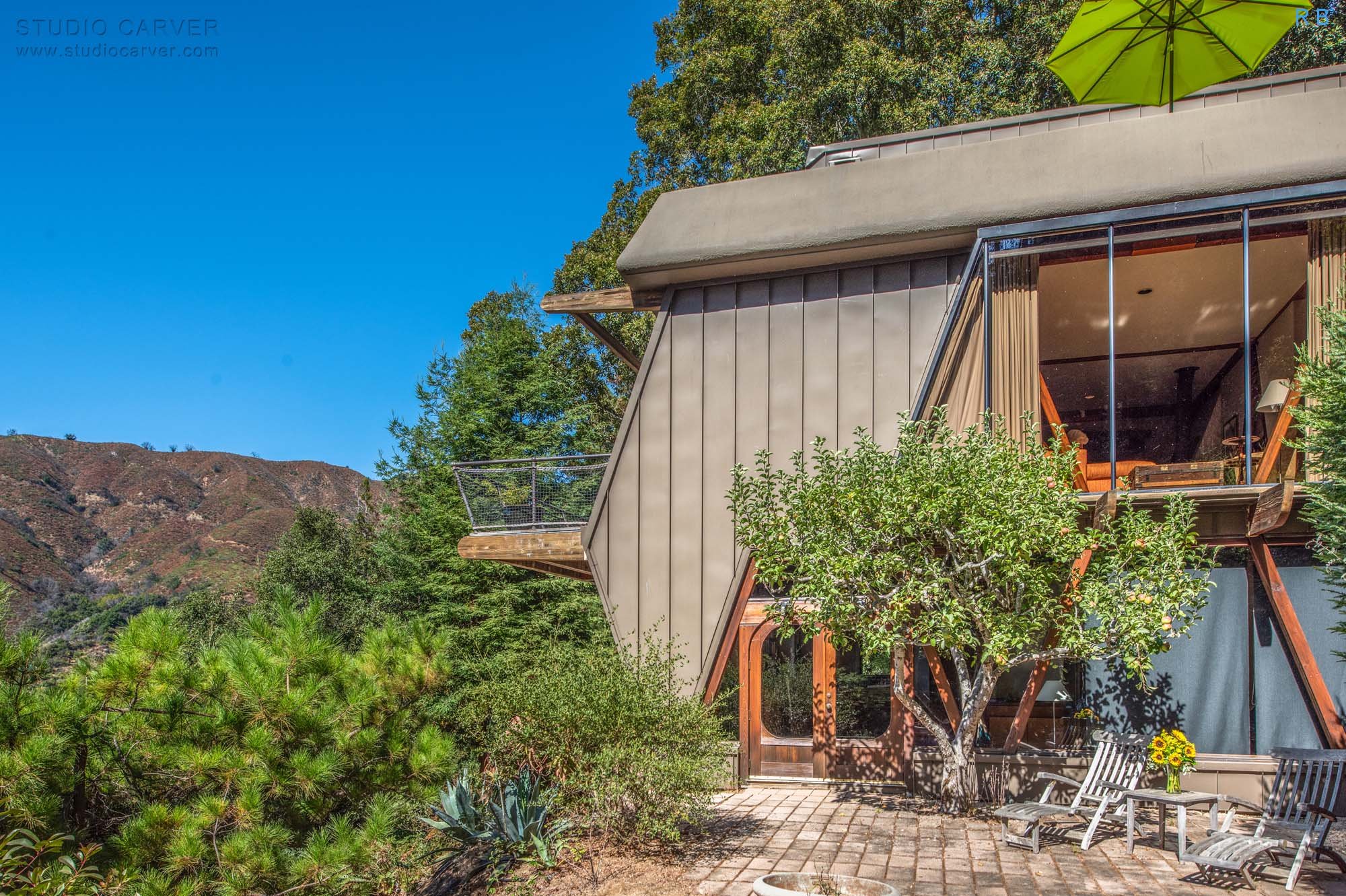 Advanced Retreat in Big Sur: A 3-Story Wooden Oasis. Sustainable Design, Ocean Views, and Sun-Drenched Patios in 2,405 SF of Tranquility.