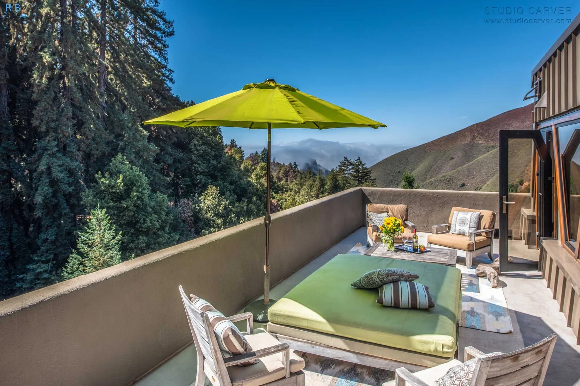 Advanced Retreat in Big Sur: A 3-Story Wooden Oasis. Sustainable Design, Ocean Views, and Sun-Drenched Patios in 2,405 SF of Tranquility.