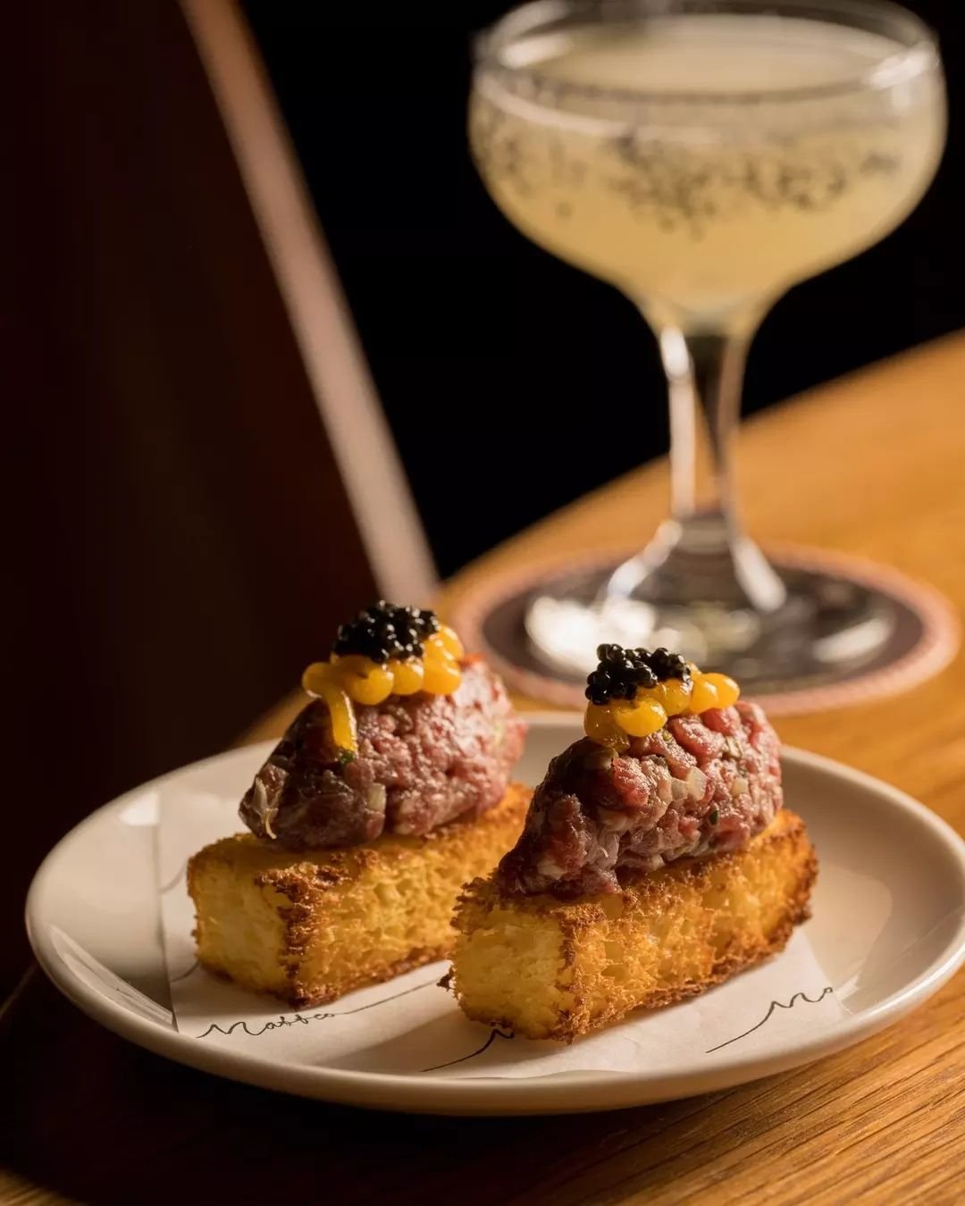 A small taste - House made brioche, beef tartare, gherkins, shallots, capers, mustard, egg yolk jam, and CRU caviar.